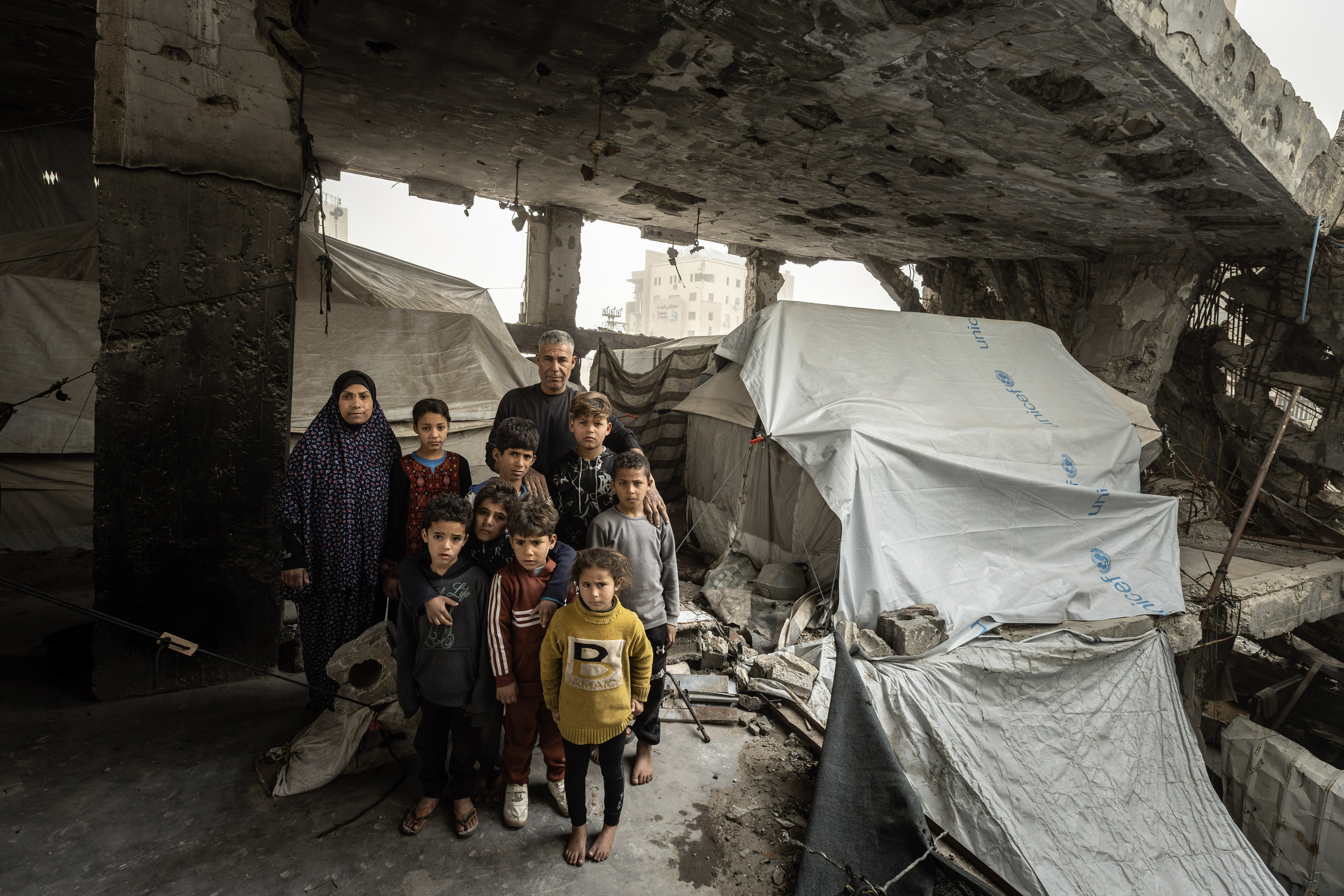 "My family is large, and this is the biggest burden I bear: securing food and basic necessities amidst this ongoing displacement,” says Saeed Diab. A father of ten, Saeed lost his job and his home early in the war. Displaced from the Shuja'iyya neighborhood in eastern Gaza City, his family now shelters in two makeshift tents inside a collapsing building in the Rimal neighborhood in the west of the city.