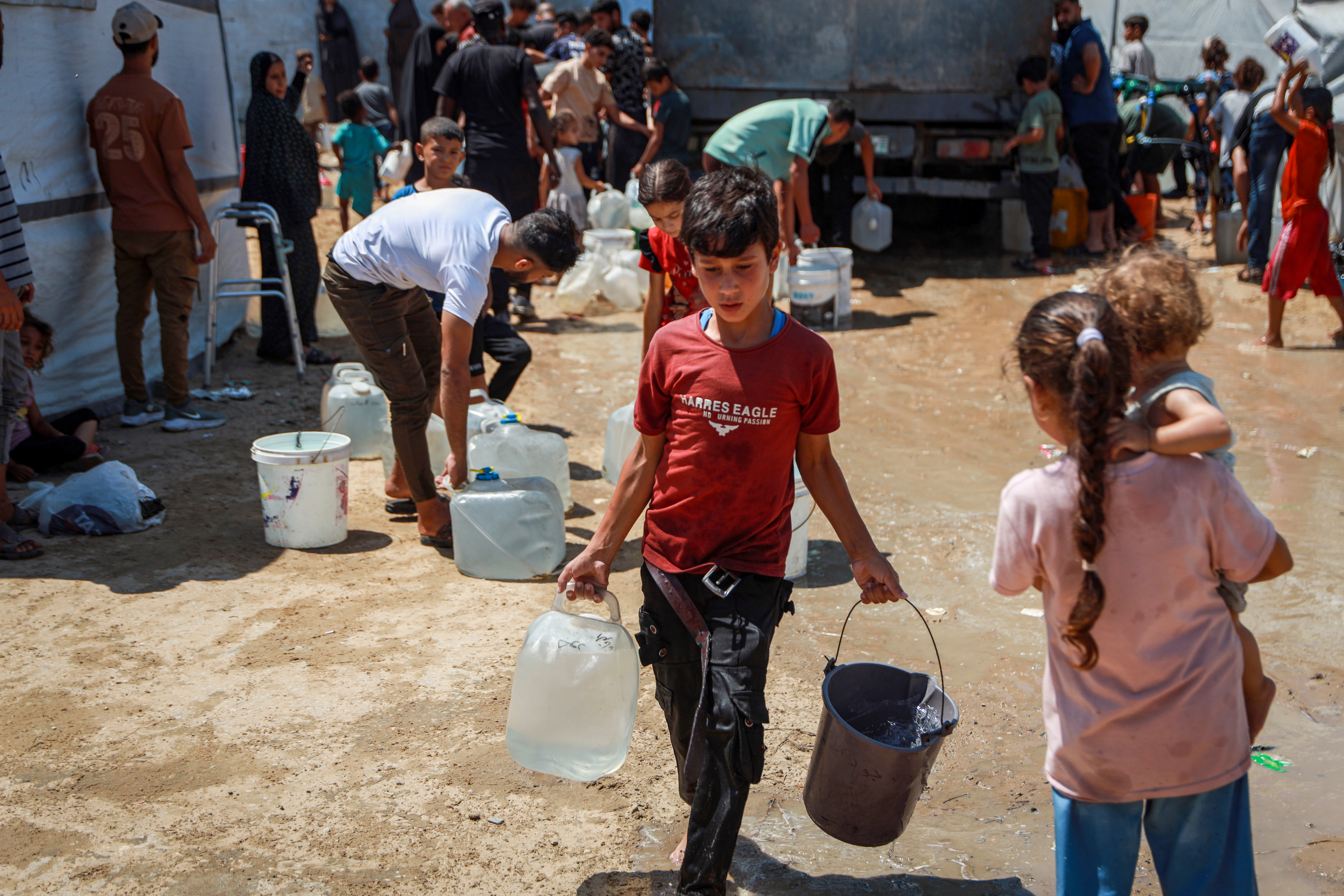 Because of the war, children in Gaza have been forced to shoulder responsibilities far beyond their years, including collecting water, waiting in food queues, and gathering firewood.