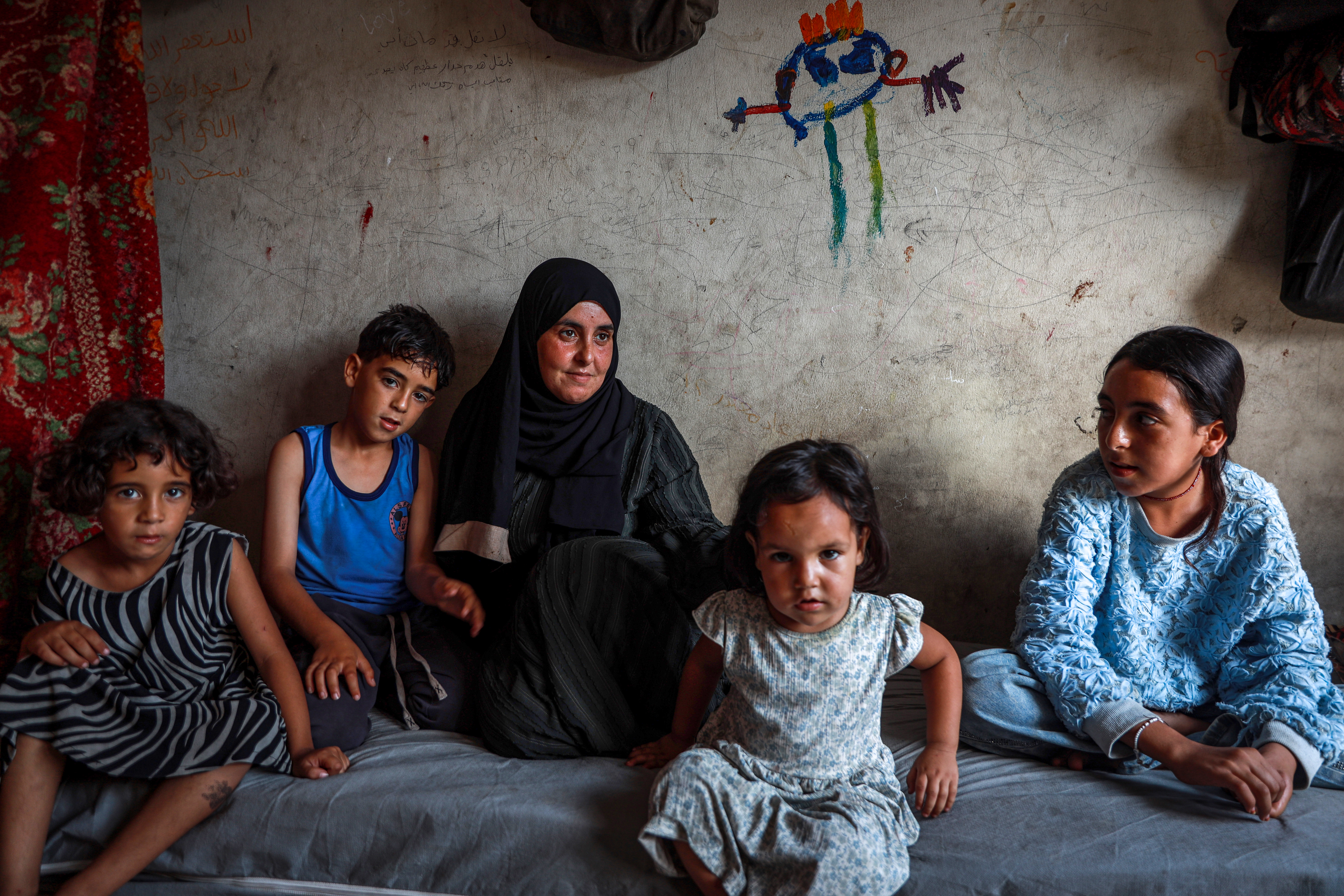 Faten Nabhan with her children, Salsabeel, 14; Mohammed, 12; Tala, 6; and Alfat, 3, who lost their father Raafat during the war on Gaza.