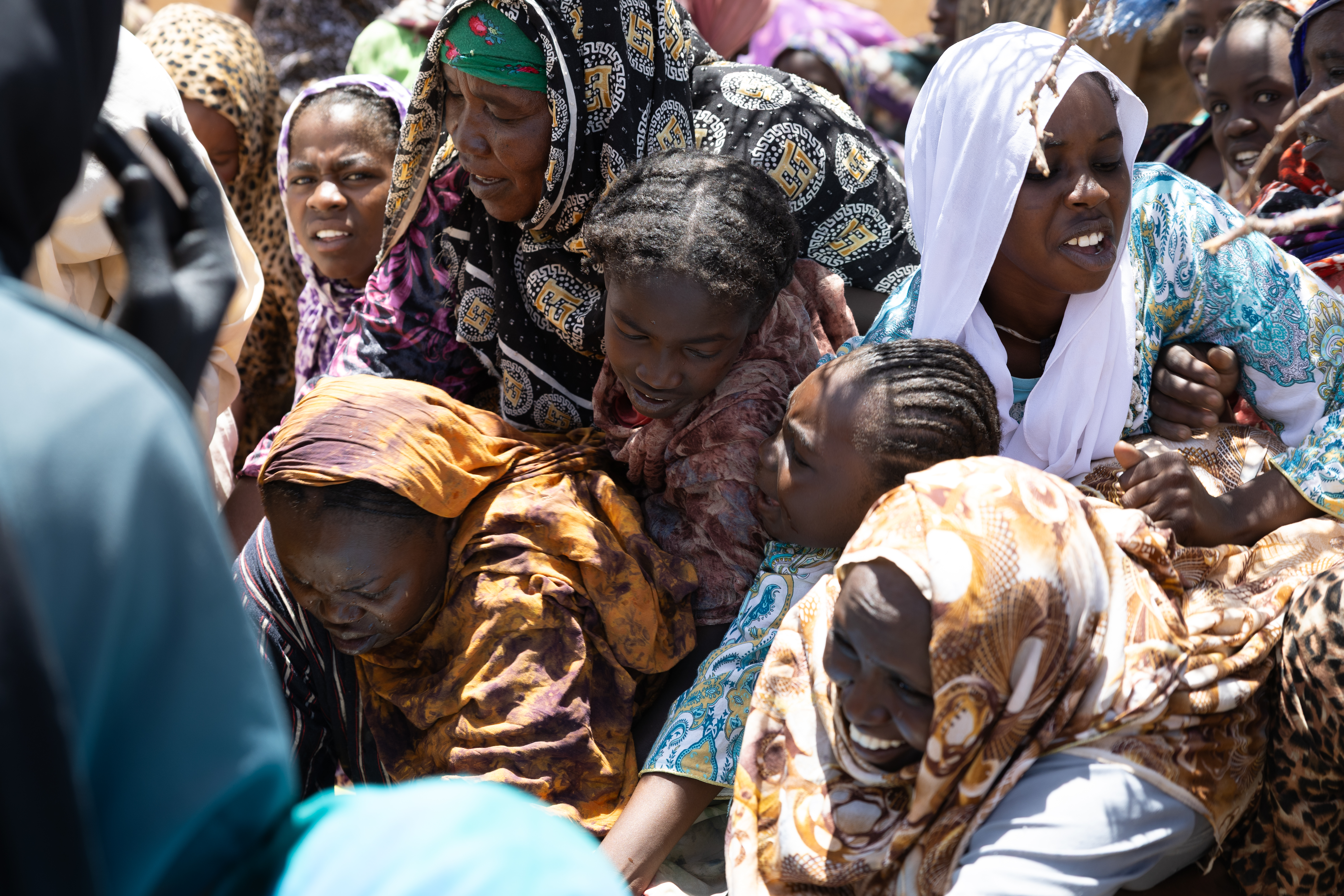 Sudanese refugees scramble to collect water at Goudrane refugee camp in eastern Chad amid growing shortages across the settlement.