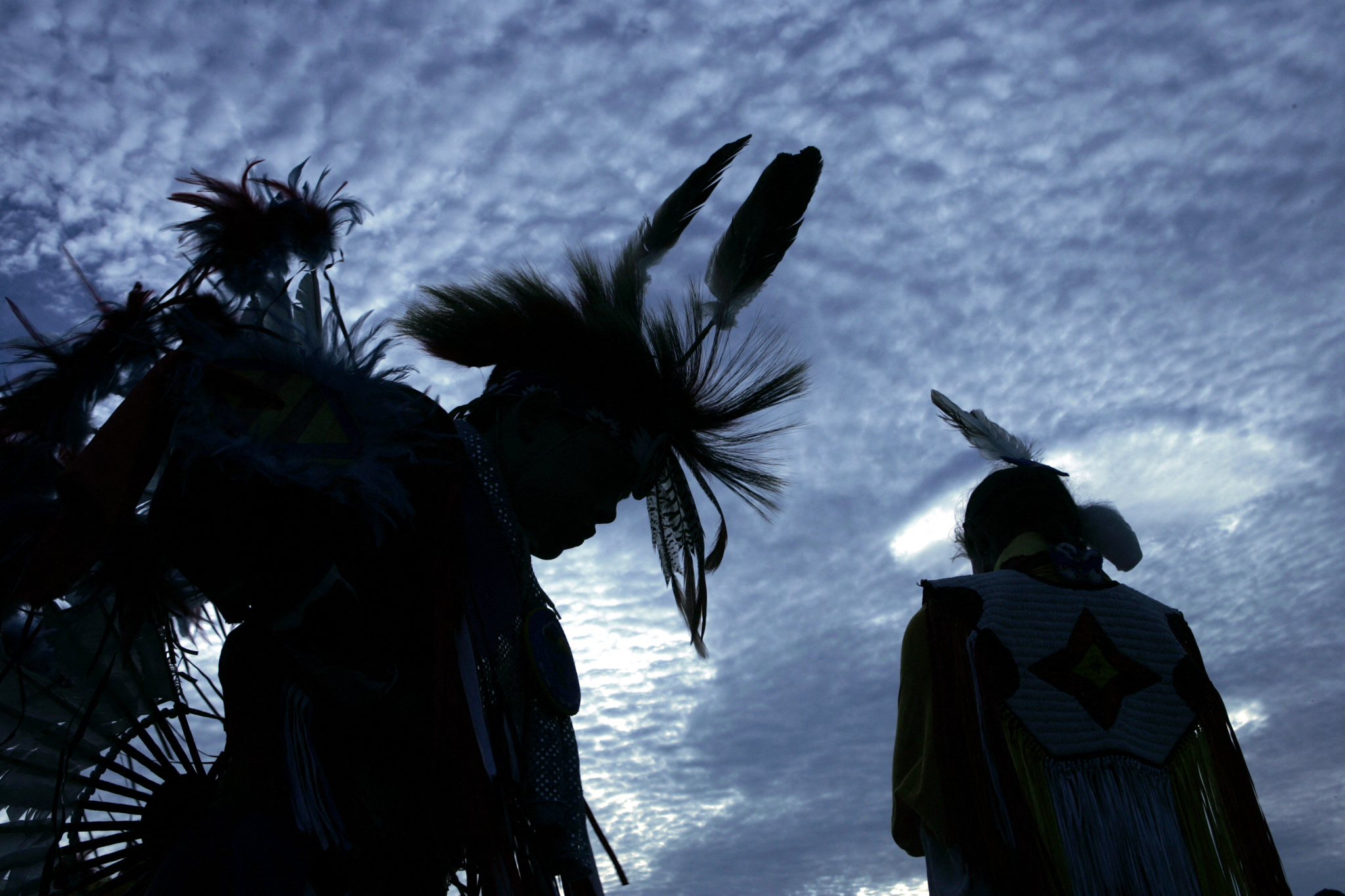 Members of the Lumbee Tribe in North Carolina, wait for a tribal dance on the National Mall after the grand opening of the Smithsonian's National Museum of the American Indian 21 September, 2004 in Washington, DC. [Brendan Smialowski/AFP]