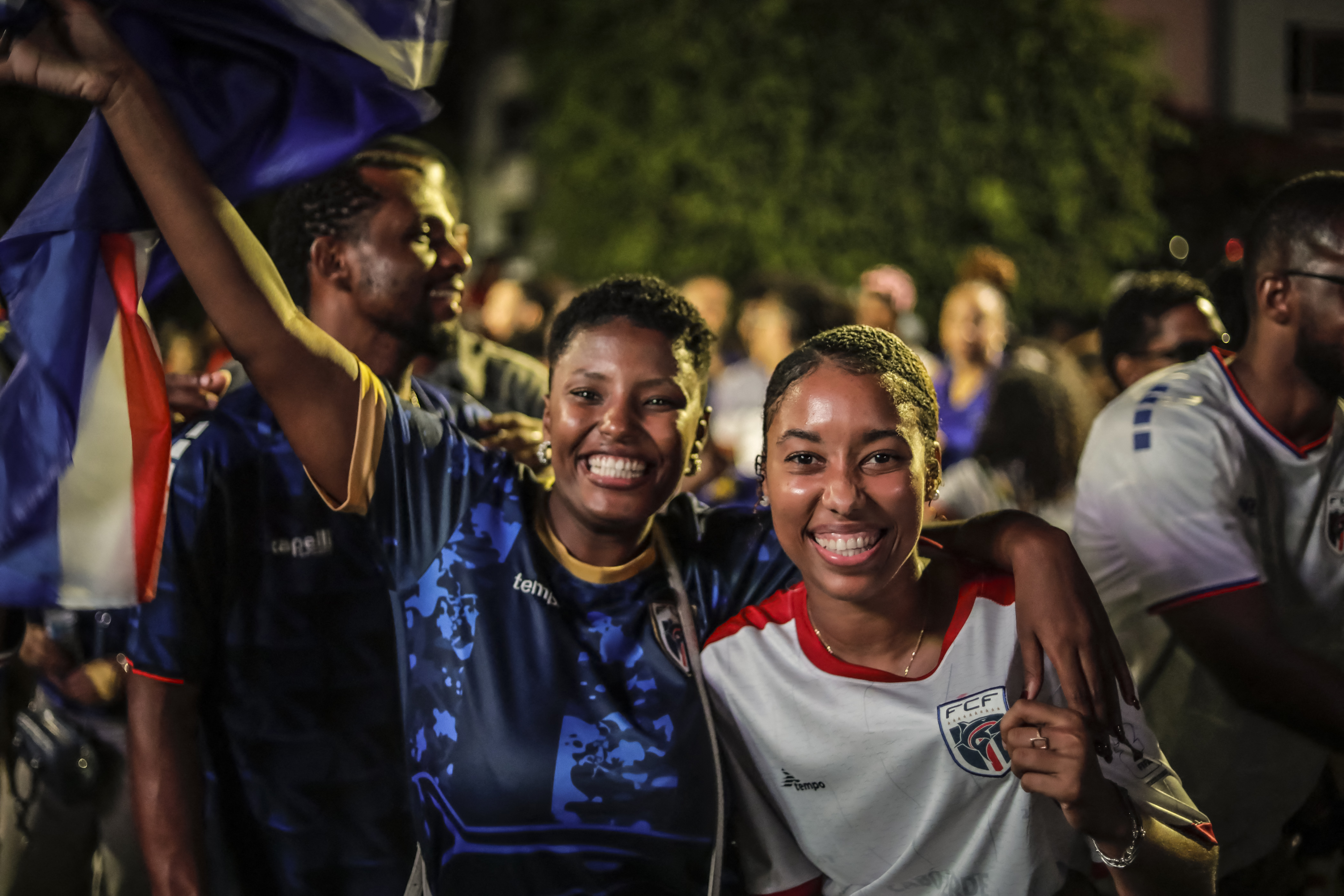 Supporters of Cape Verde's national football team celebrate after their team qualified for the knockout stage of the 2026 World Cup in Praia, on June 27, 2026. (Photo by JOSE CORREIA / AFP)