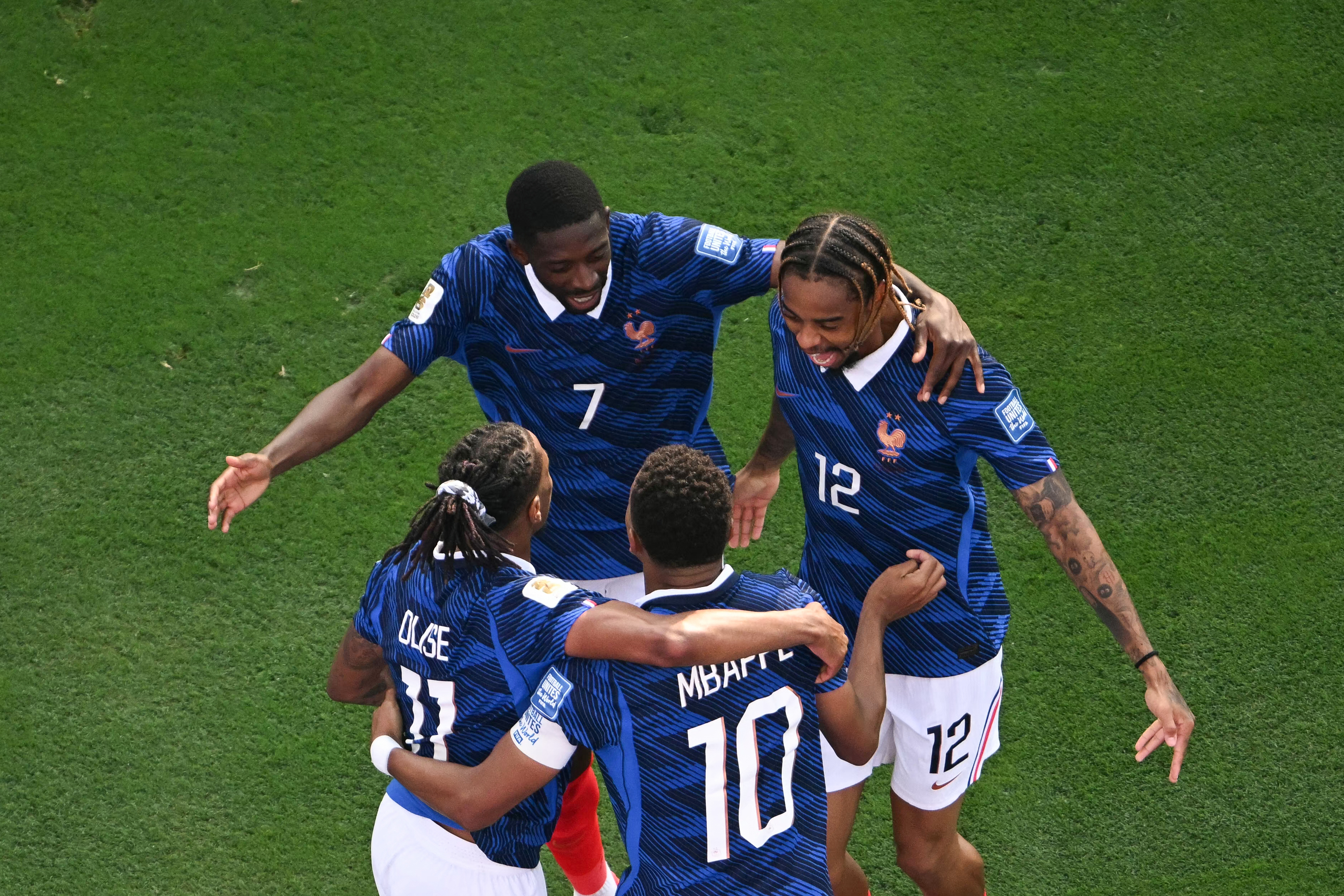 France's forward #10 Kylian Mbappe celebrates scoring his team's third goal with forward #07 Ousmane Dembele and forward #12 Bradley Barcola during the 2026 World Cup round of 32 football match between France and Sweden at the New York/New Jersey Stadium in East Rutherford on June 30, 2026. (Photo by MAURO PIMENTEL / AFP)
