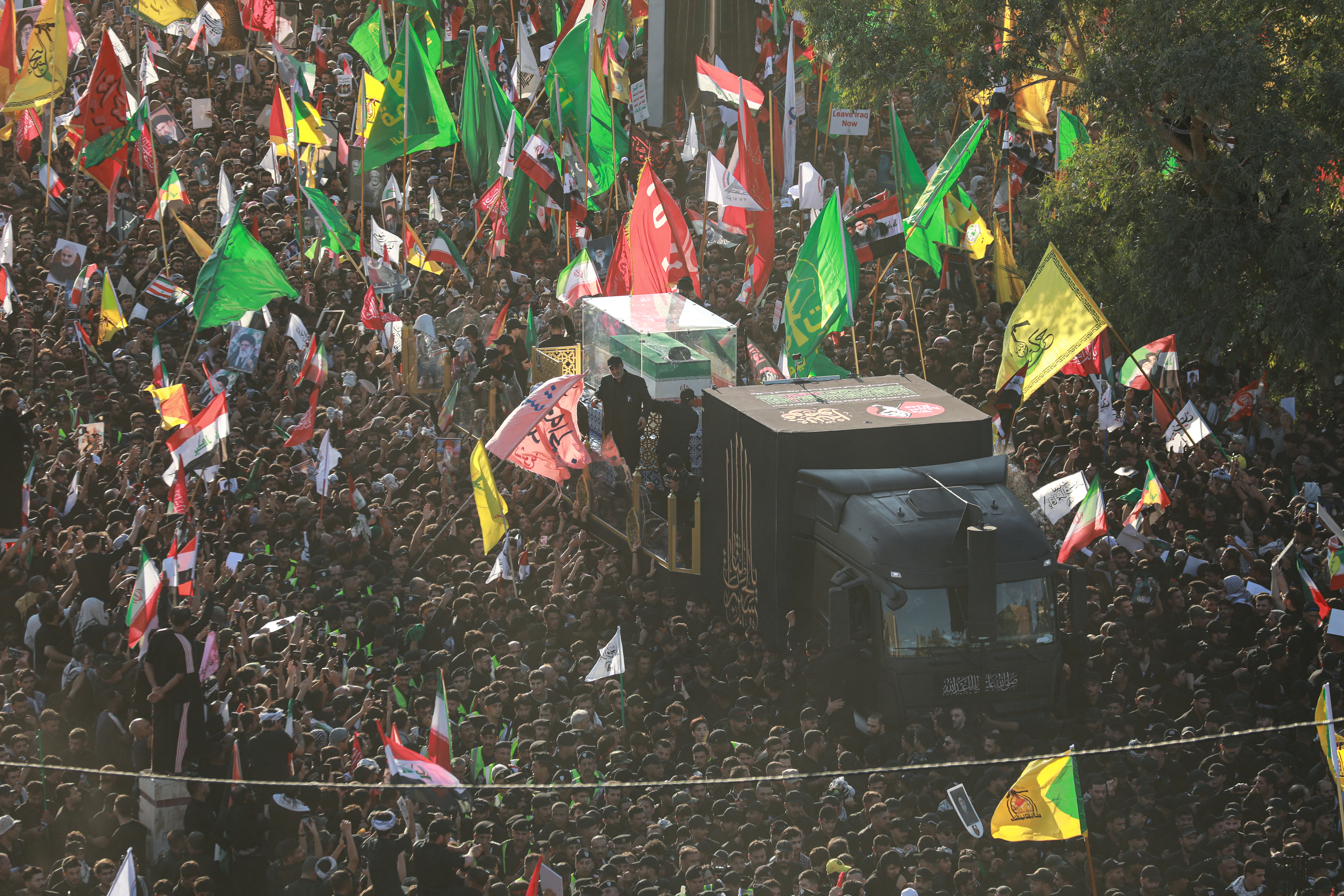Crowds of mourners surround the convoy carrying the coffin of Iran's slain Supreme Leader Ali Khamenei during a funeral procession in Najaf, Iraq on July 8, 2026.