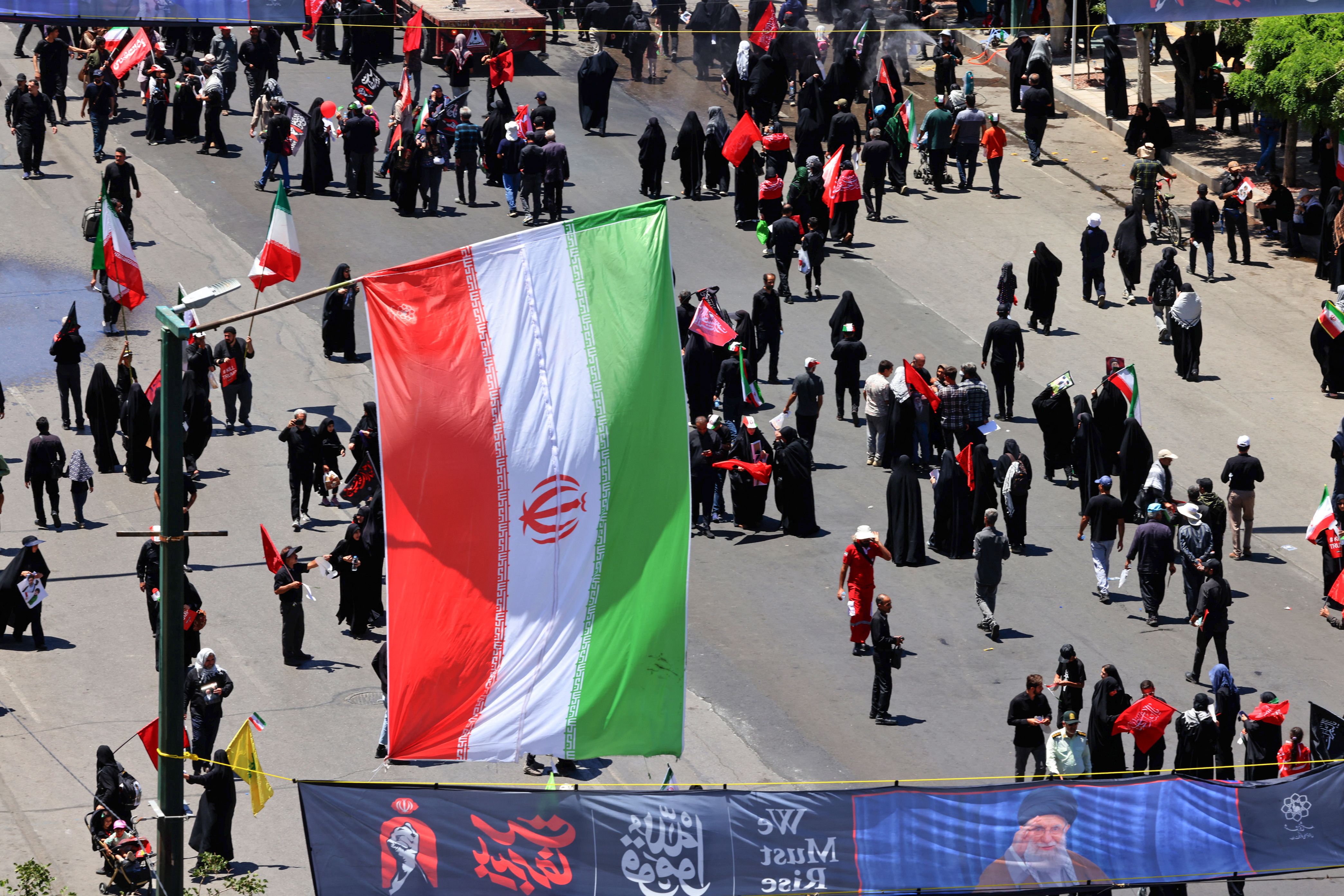Mourners gather in the street ahead of the funeral of Iran's slain supreme leader Ali Khamenei a