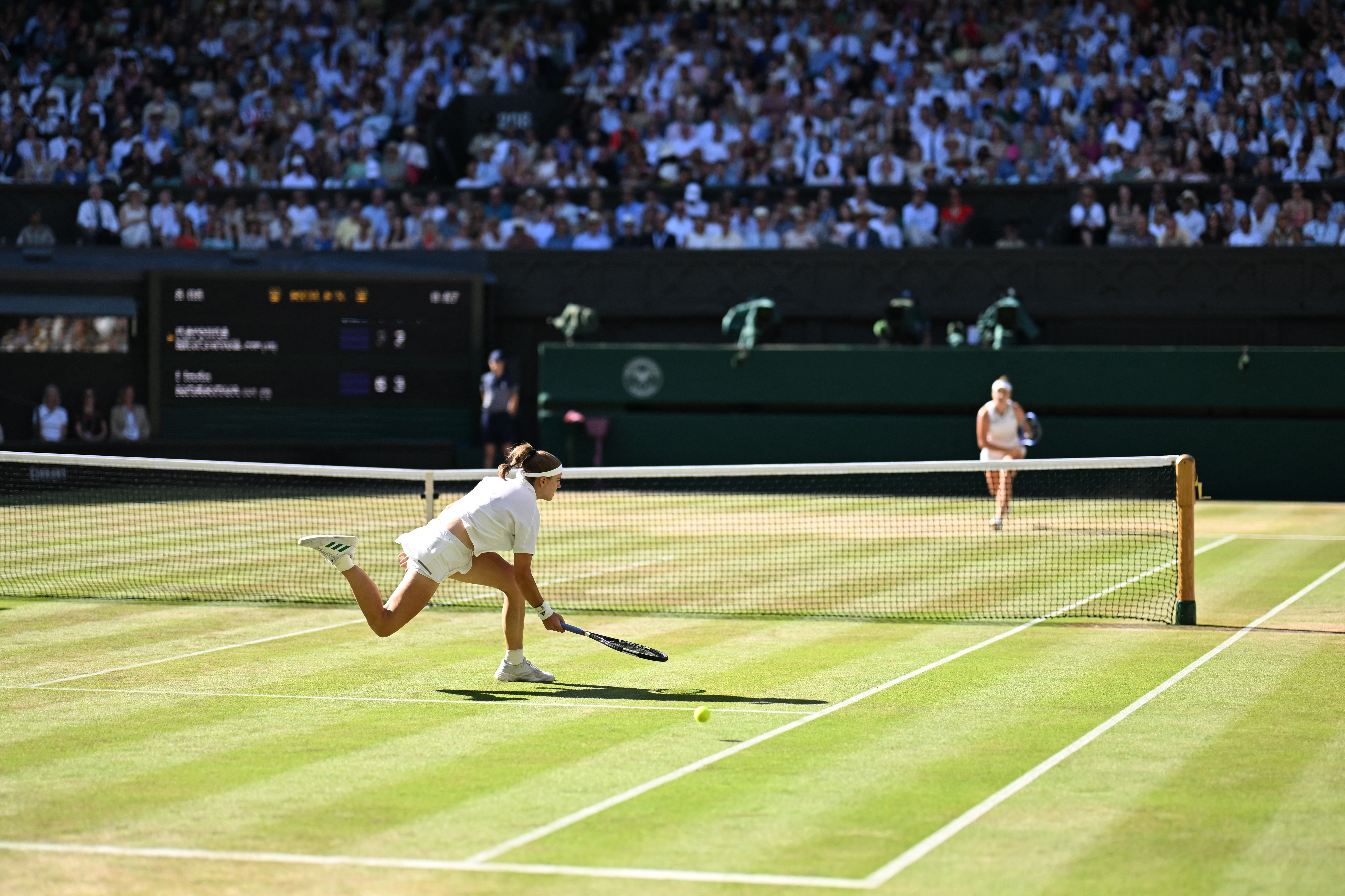 Linda Noskova, right, hits a winner past Karolina Muchova during the final