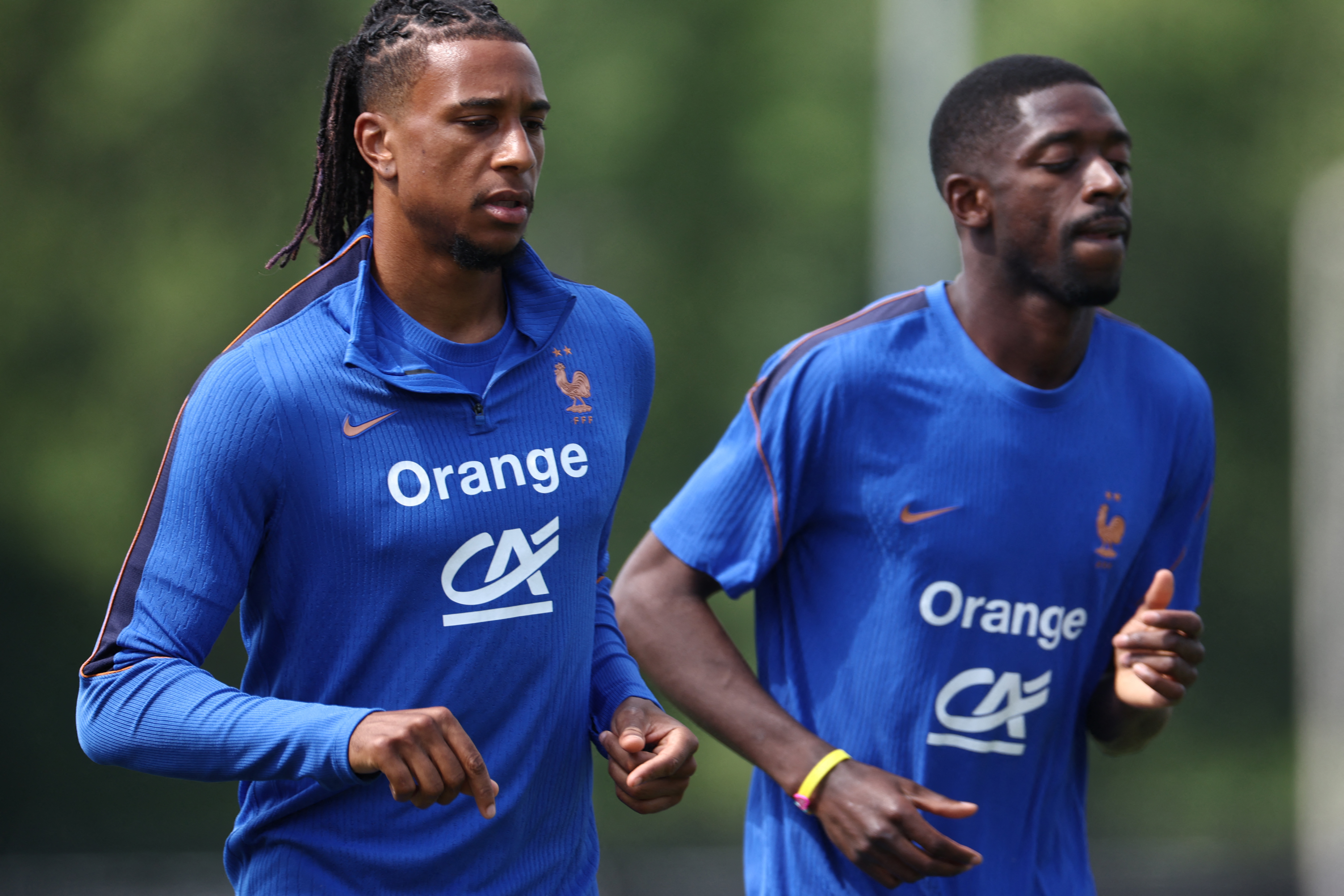 Michael Olise and Ousmane Dembele in action.