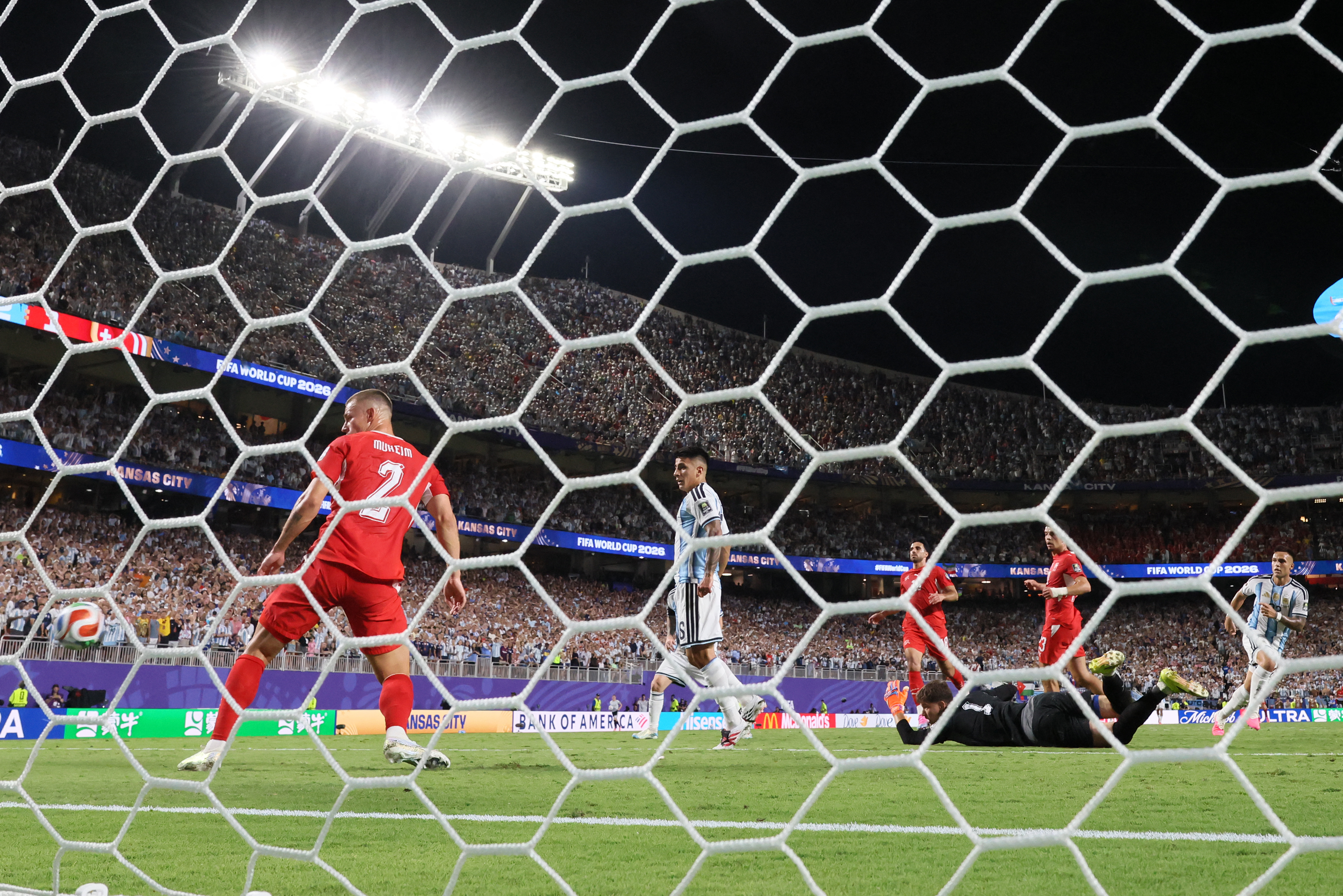 Argentina’s Lautaro Martinez, right, scores the match winner against Switzerland in their quarterfinal at the Kansas City Stadium on July 11, 2026