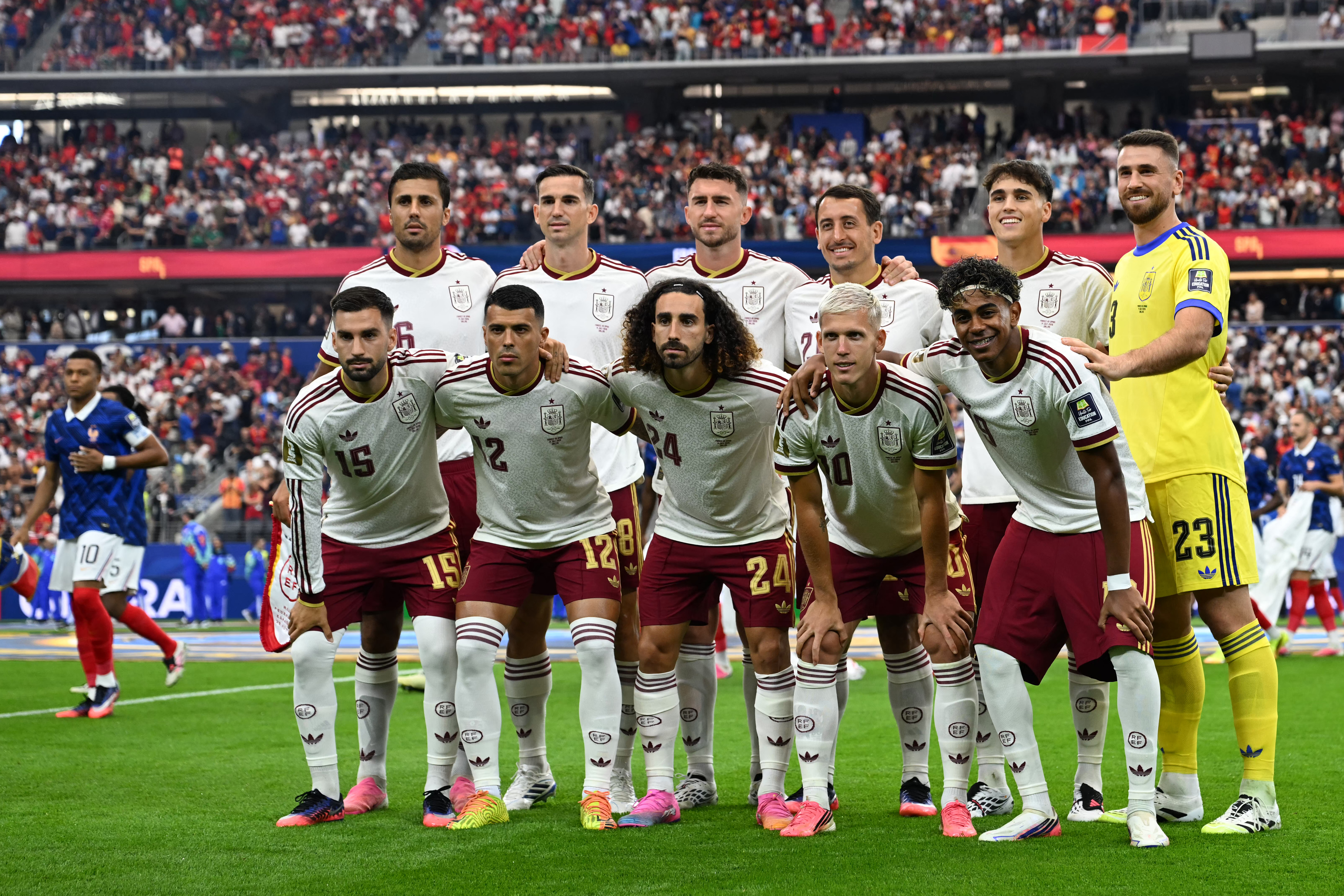 (Bottom from L) Spain's midfielder #15 Alex Baena, Spain's defender #12 Pedro Porro, Spain's defender #24 Marc Cucurella, Spain's forward #10 Dani Olmo, Spain's forward #19 Lamine Yamal (top from L) Spain's midfielder #16 Rodri, Spain's midfielder #08 Fabian Ruiz, Spain's defender #14 Aymeric Laporte, Spain's forward #21 Mikel Oyarzabal, Spain's defender #22 Pau Cubarsi and Spain's goalkeeper #23 Unai Simon pose ahead of the 2026 World Cup football tournament semi-final match between France and Spain at the Dallas Stadium in Arlington on July 14, 2026. (Photo by MAURO PIMENTEL / AFP)