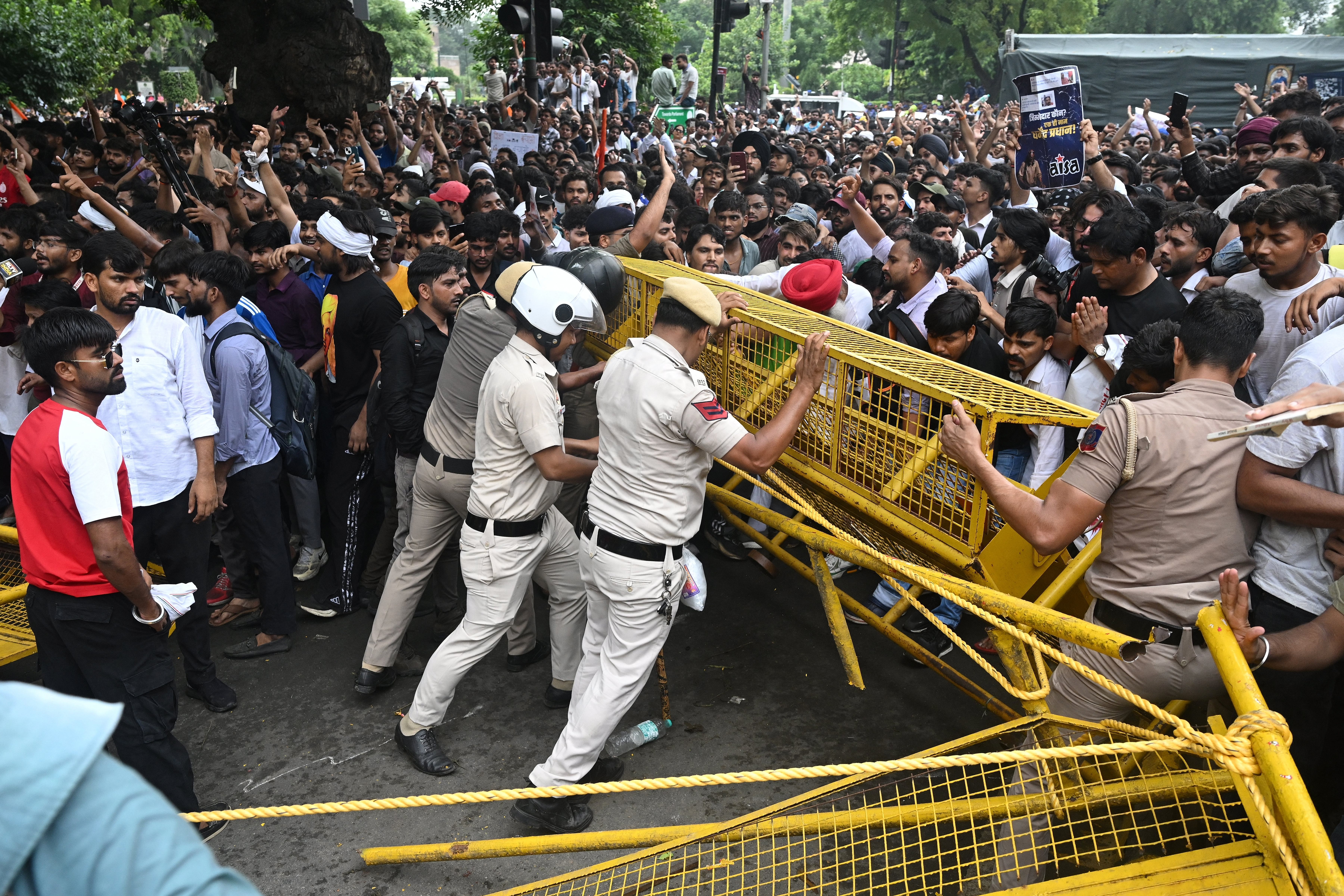 Police fire tear gas at India's Cockroach movement supporters