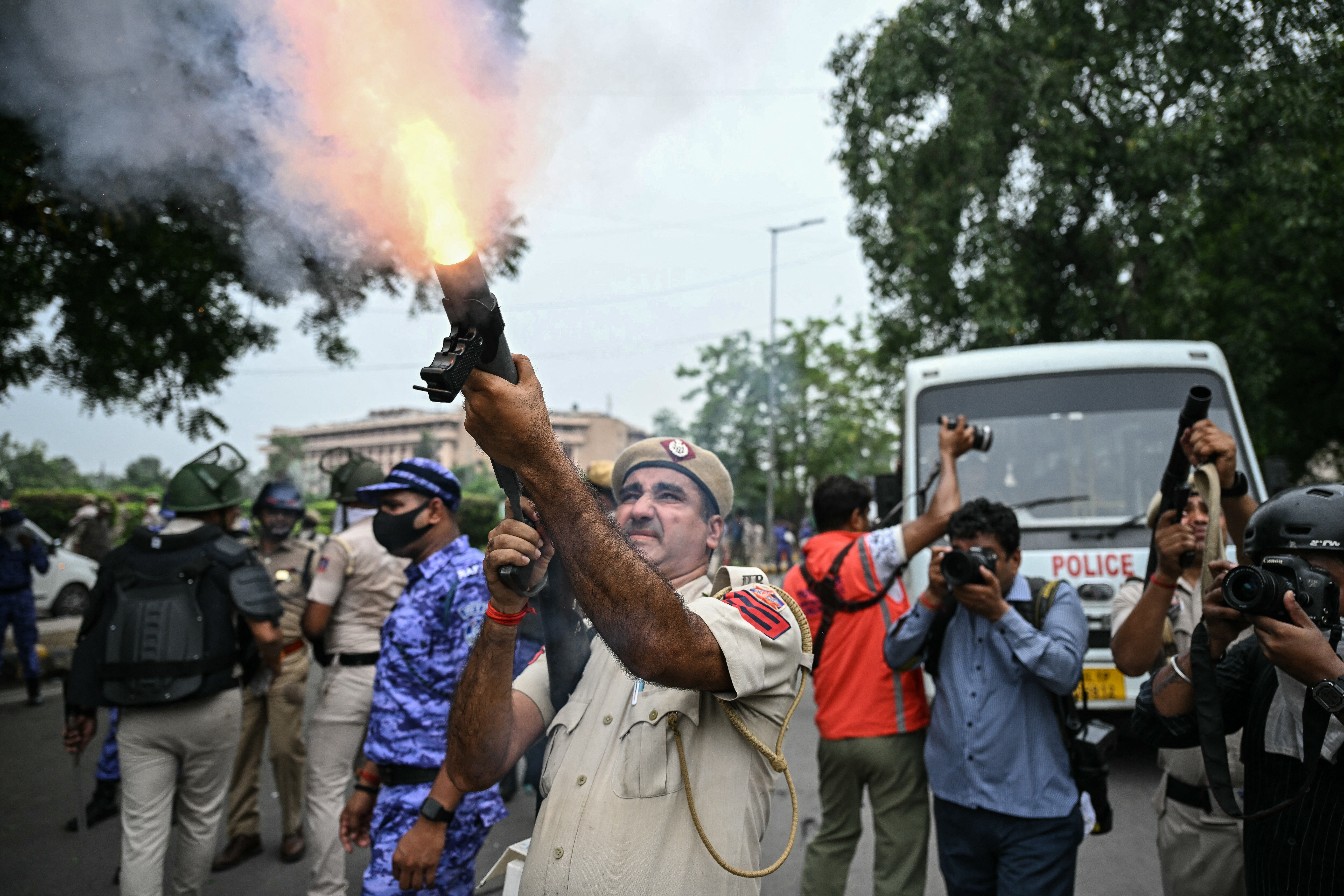 Police fire tear gas at India's Cockroach movement supporters