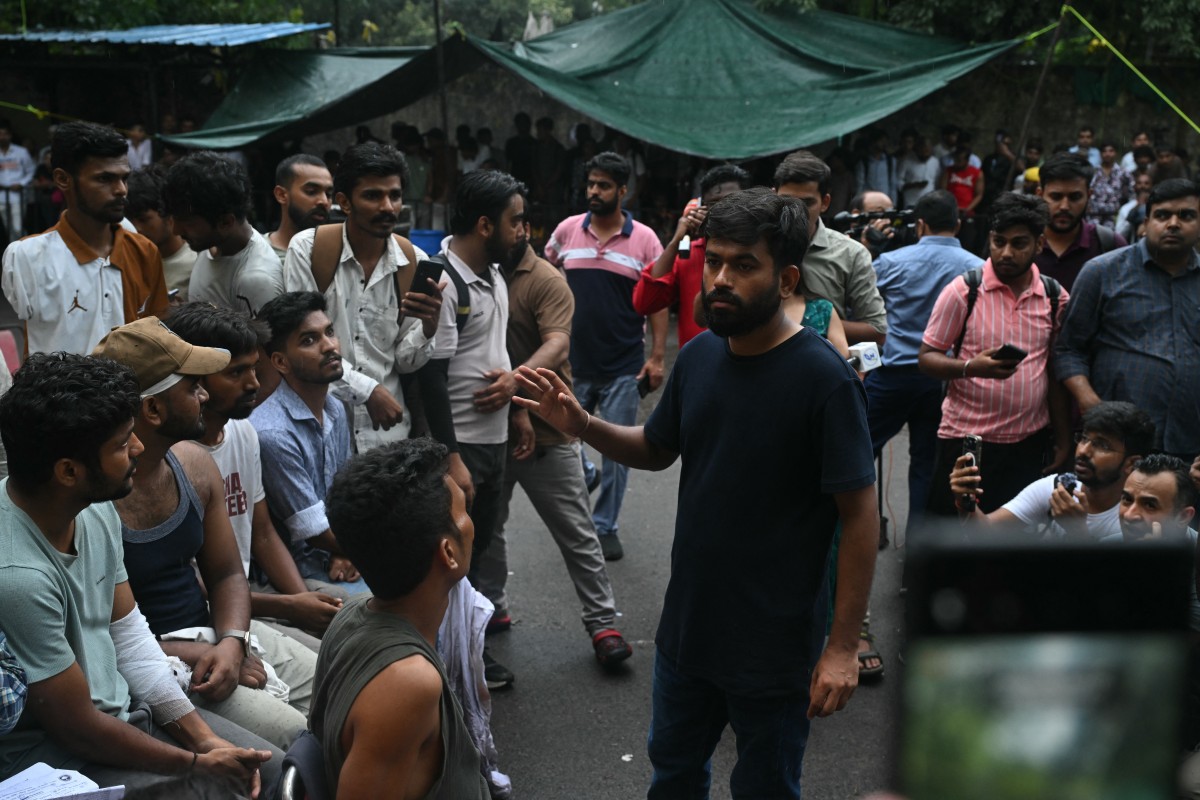 CJP founder Abhijeet Dipke speaks to protesters injured in New Delhi on July 21, 2026