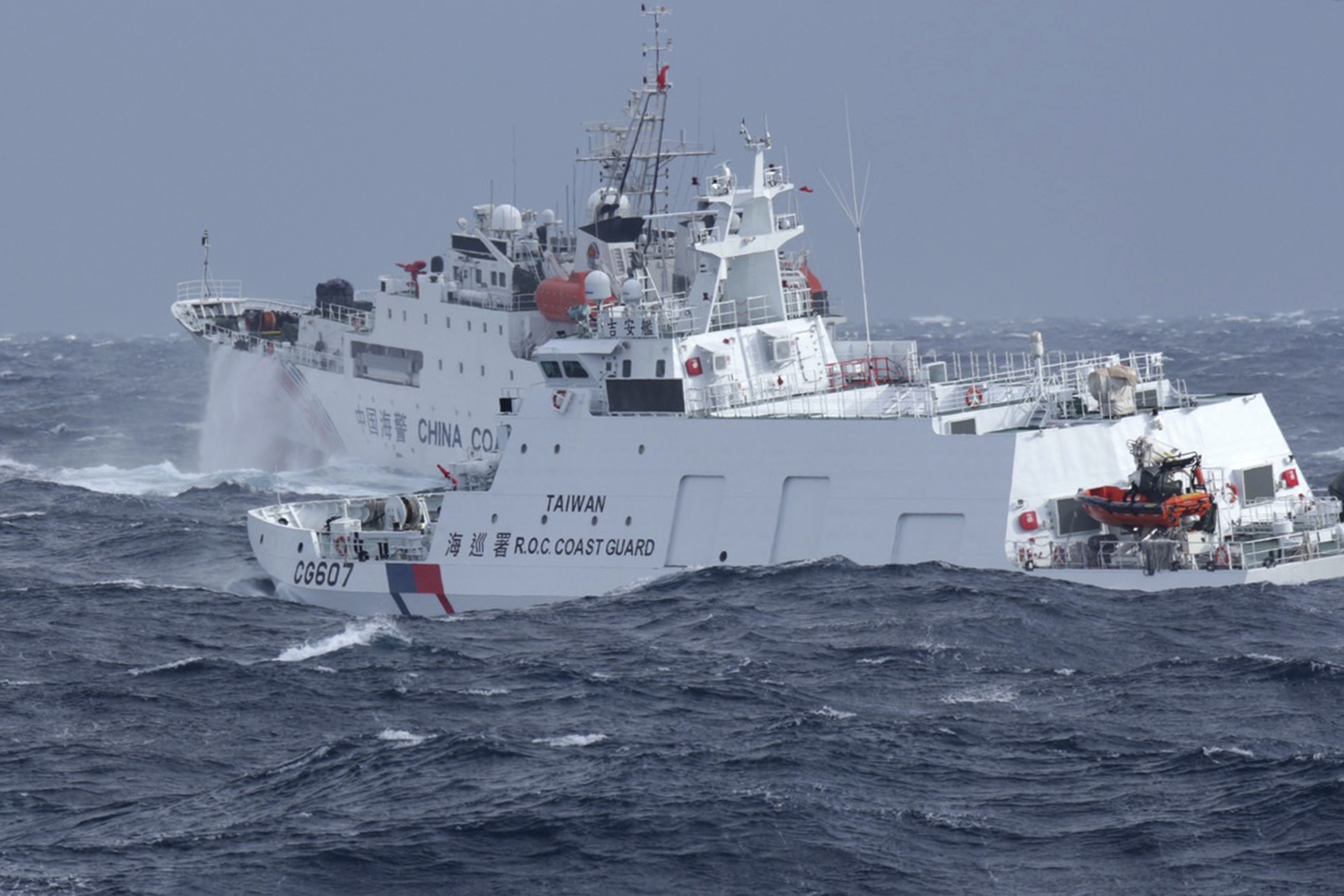 In this photo released by the Taiwan Coast Guard, Taiwan Coast Guard vessel Ji An, at right, chases after Chinese Coast Guard vessel 1302 off the coast of Hualien, eastern Taiwan on Thursday, Dec. 12, 2024. (Taiwan Coast Guard via AP)