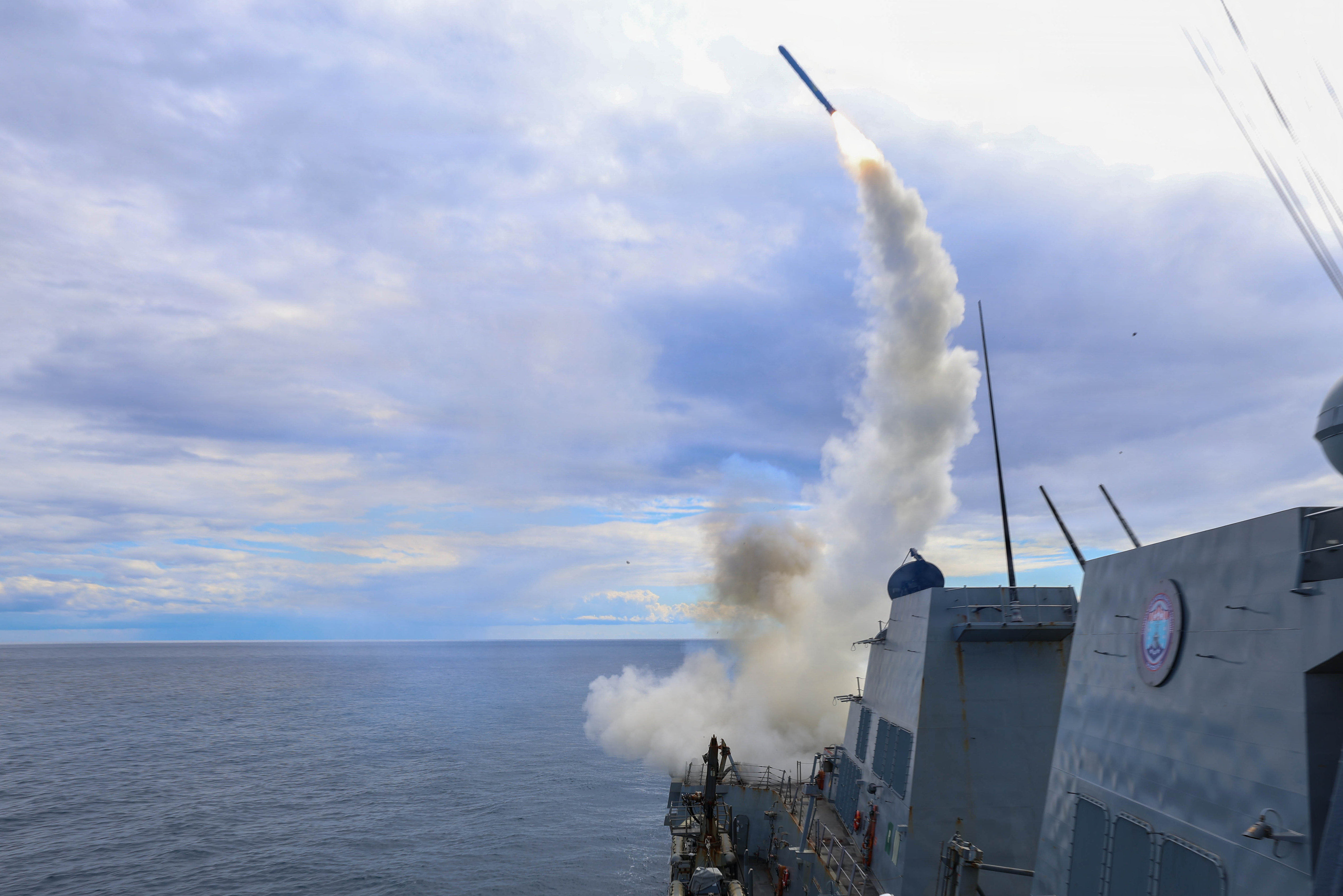 This image provided by US Central Command shows the Arleigh Burke-class guided-missile destroyer USS Thomas Hudner firing a Tomahawk Land Attack Missile [File: US Navy via AP]