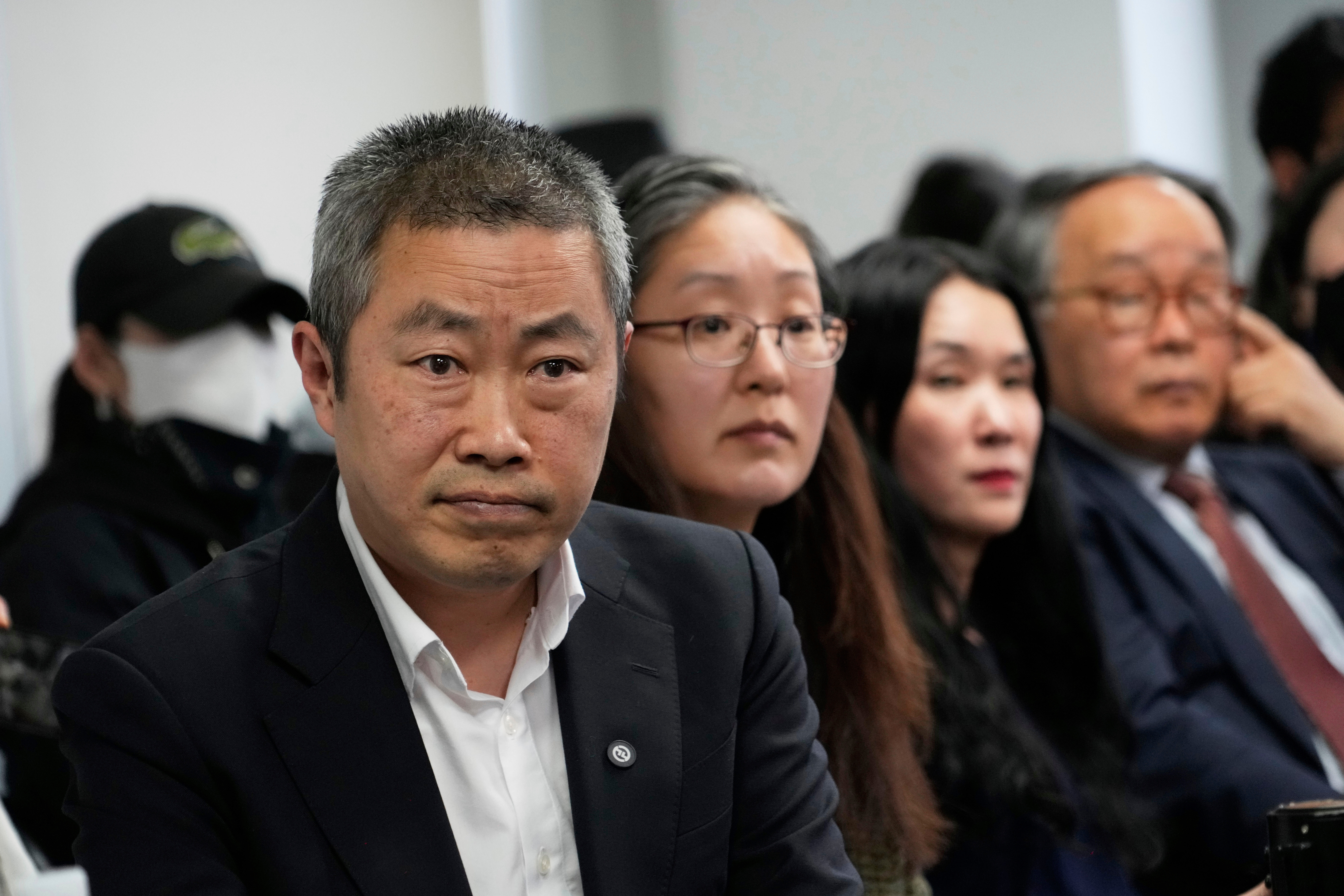 Peter Møller, left, attends a news conference at the Truth and Reconciliation Commission in Seoul, on March 26, 2025