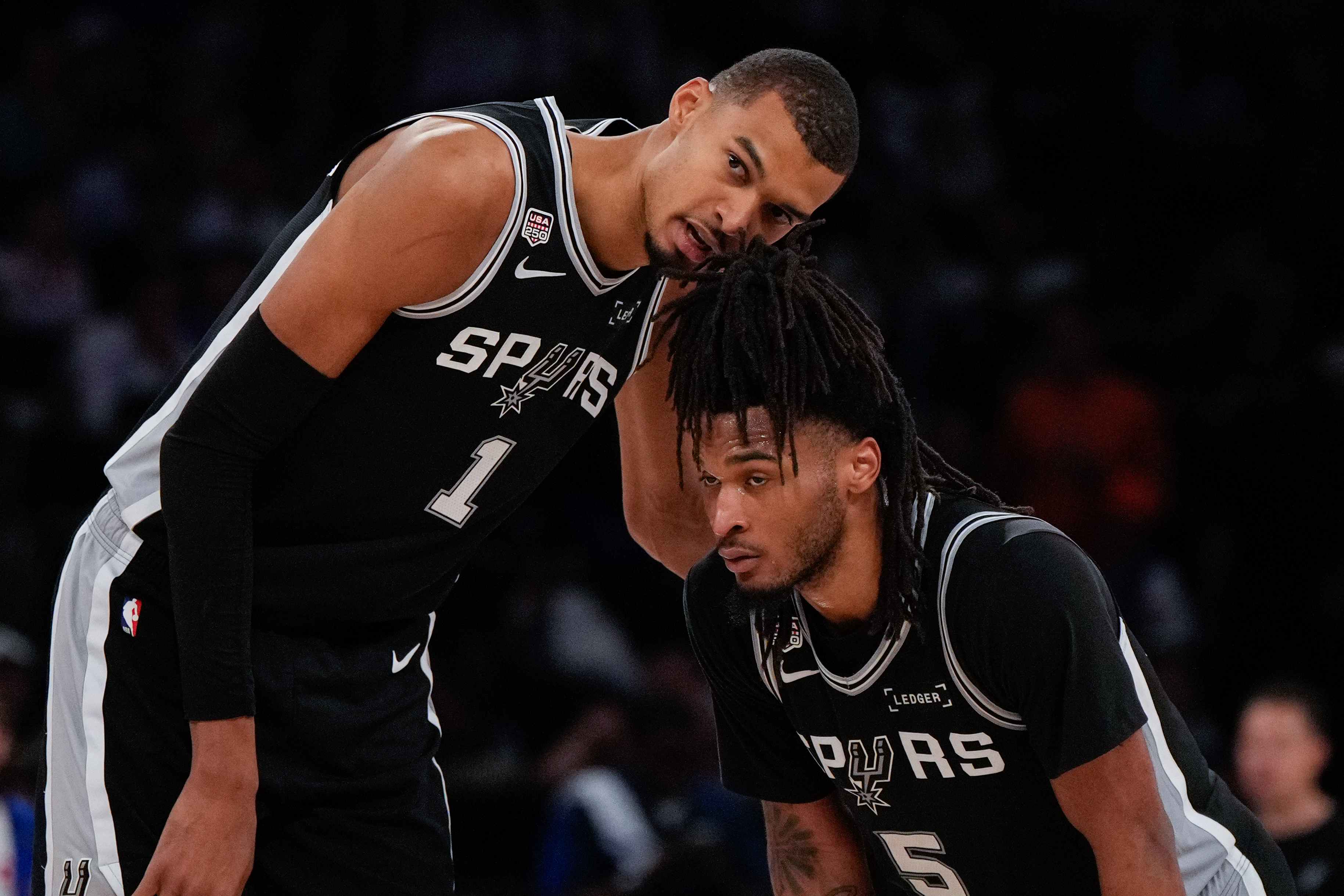 Wembanyama, left, with teammate Stephon Castle during the NBA Finals in June