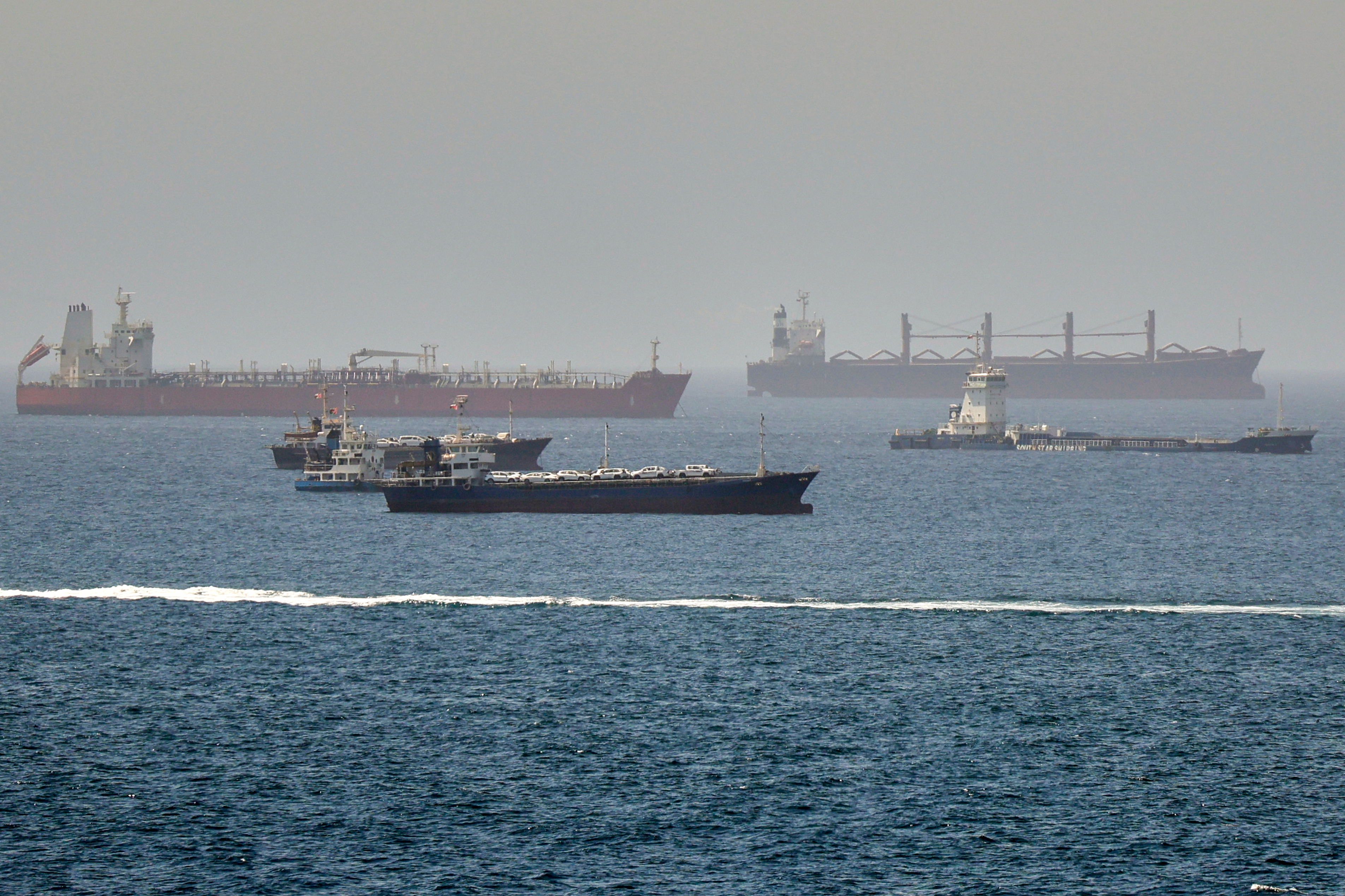 Tankers and cargo vessels are seen in the Gulf of Oman