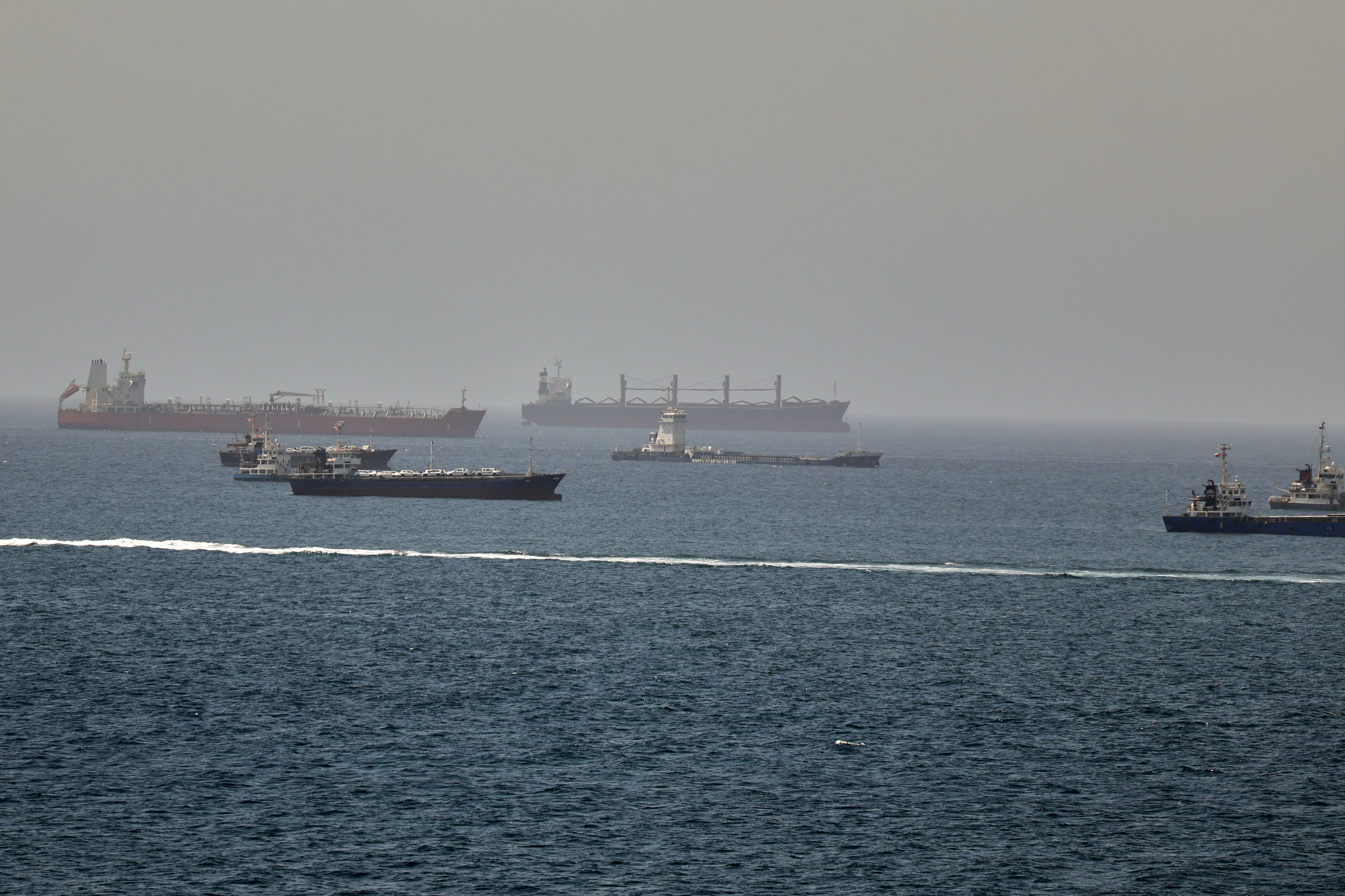 Tankers and cargo vessels in the Gulf of Oman, along shipping routes linking the Strait of Hormuz and the Arabian Sea, June 16, 2026 [AP Photo]