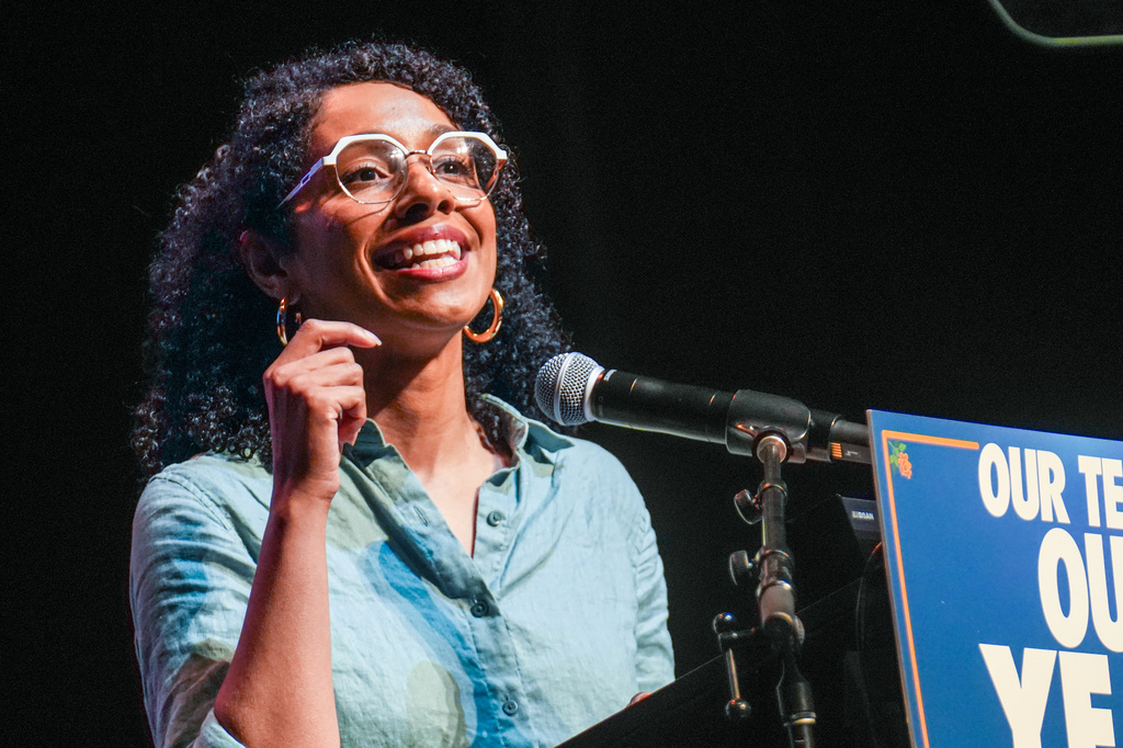 Darializa Avila Chevalier in denim shirt