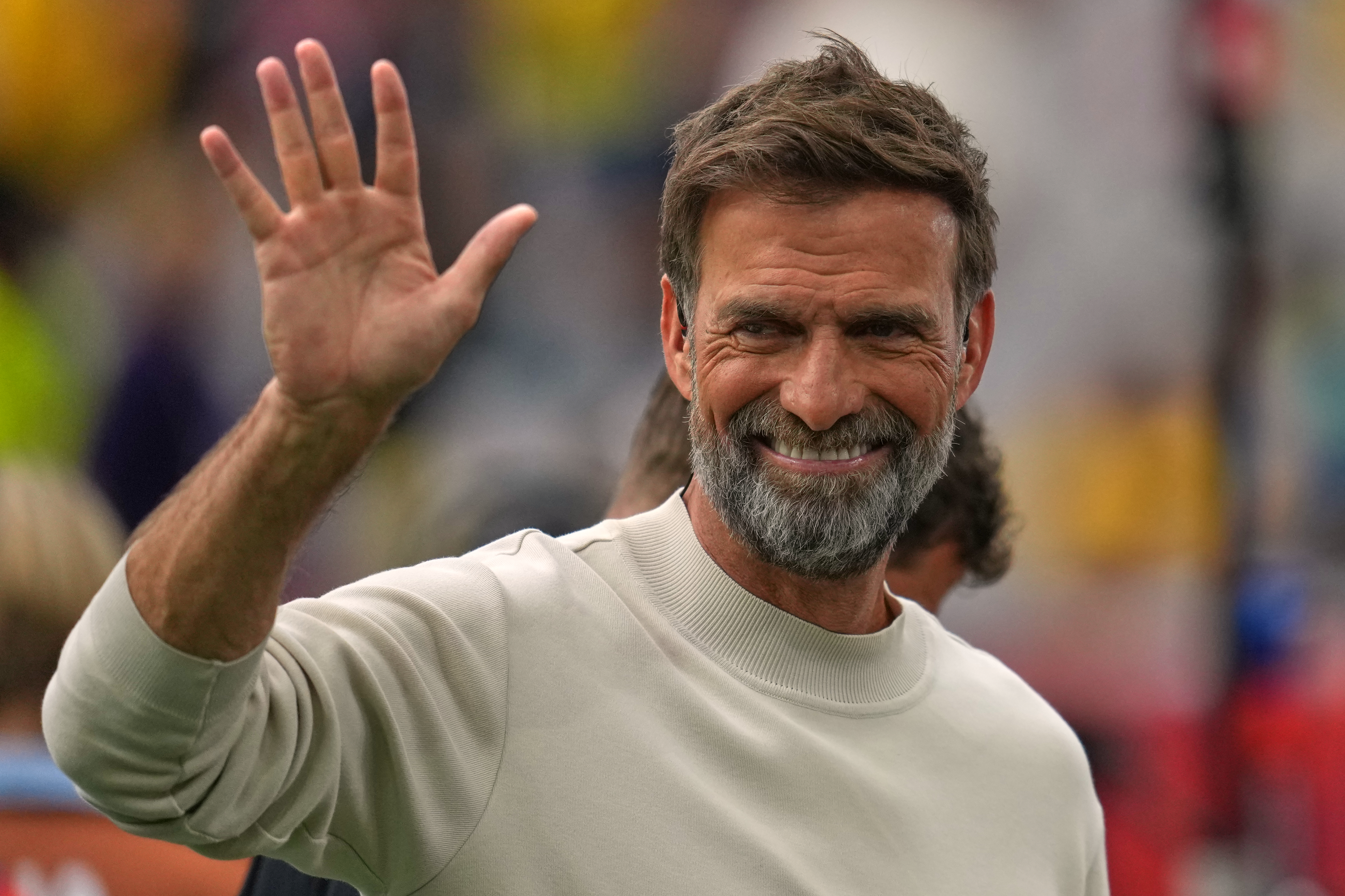 A man waves