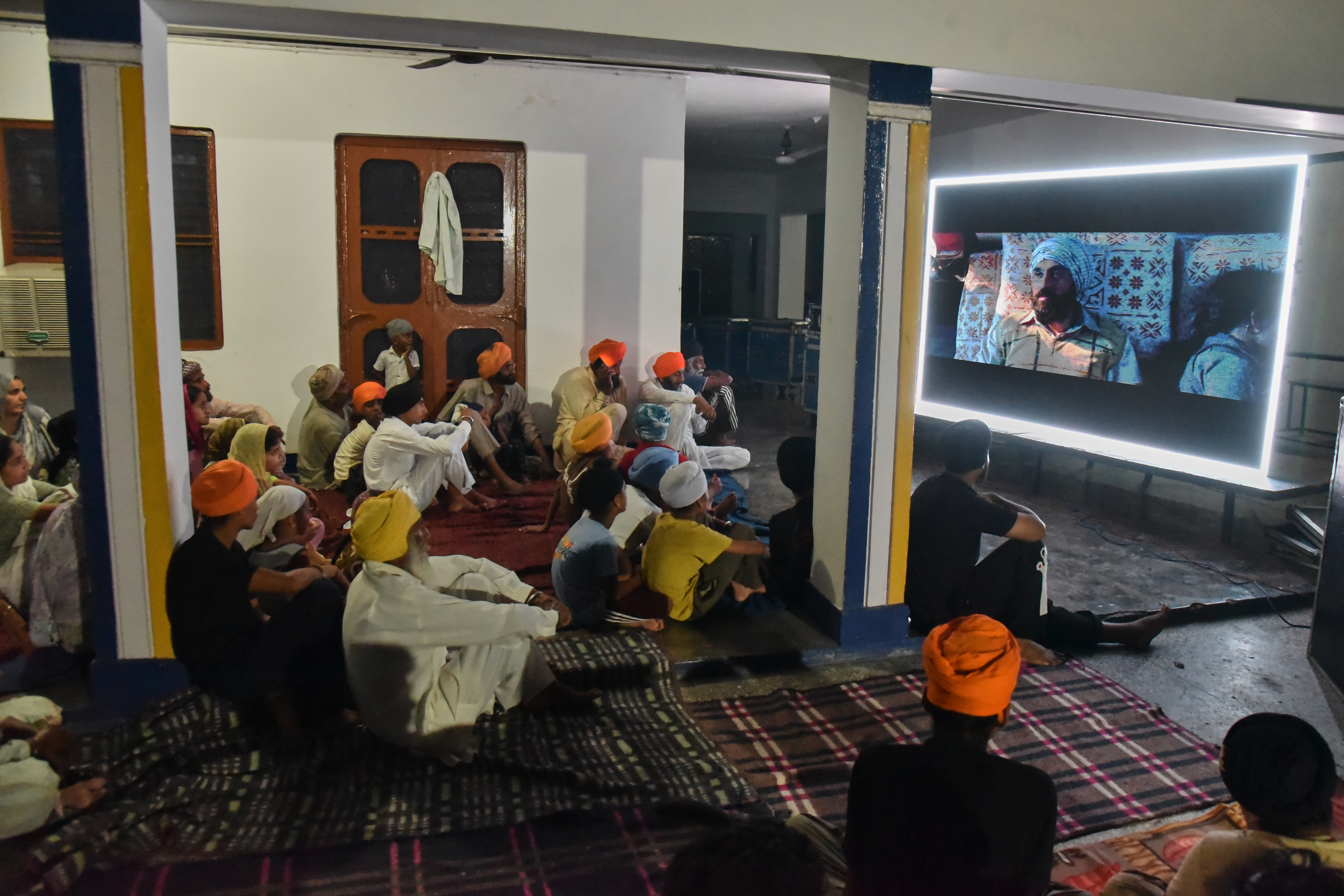 People watch Satluj at a Sikh temple at Tatley village, Gurdaspur, Punjab, India, July 8, 2026