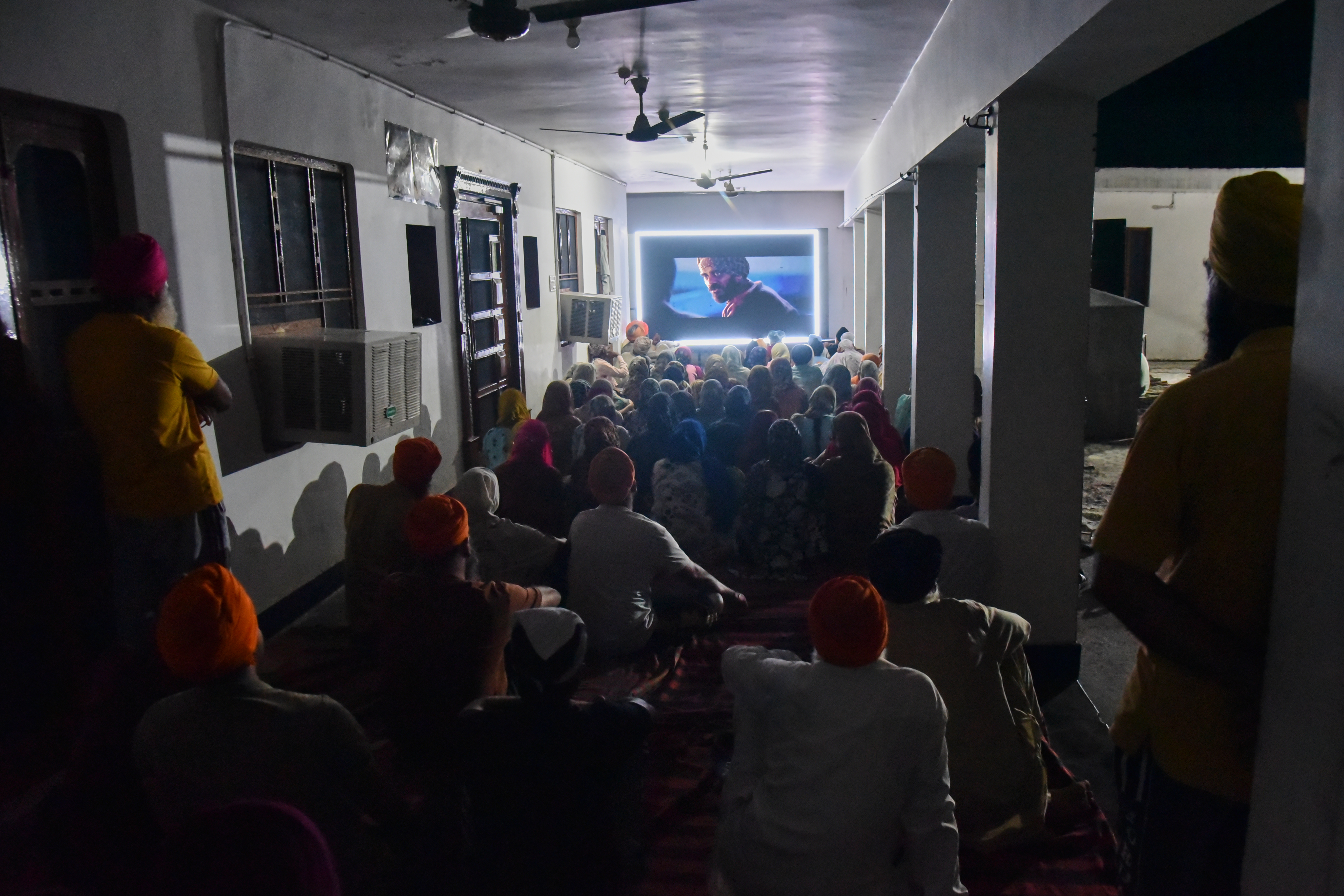 Villagers watch a special screening of Satluj at a Sikh temple at Tatley village, in Punjab’s Gurdaspur district, India, July 8, 2026