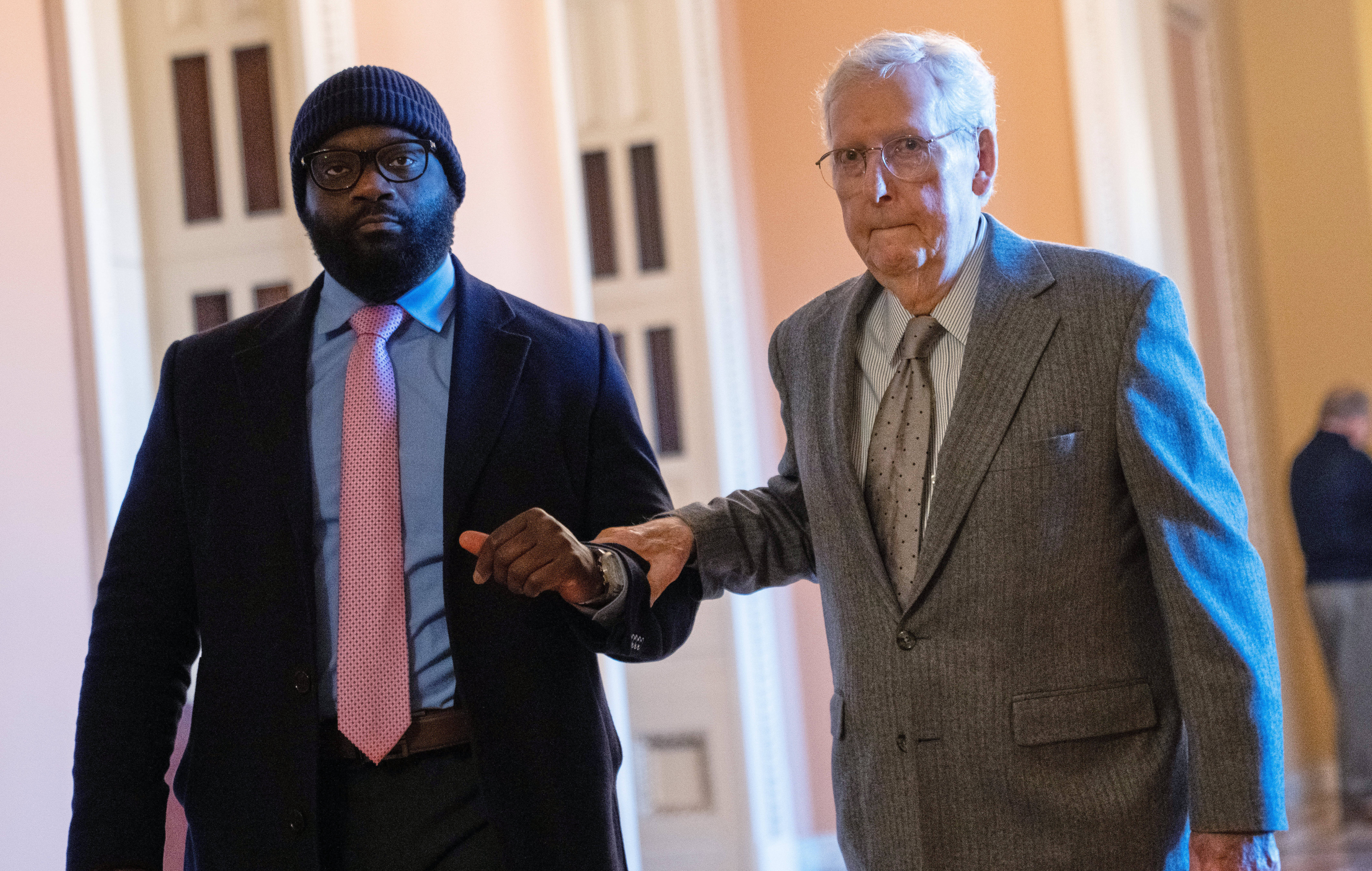 FILE - Sen. Mitch McConnell, R-Ky., right, walks through the Capitol, Jan. 15, 2026, in Washington. (AP Photo/Allison Robbert, File)