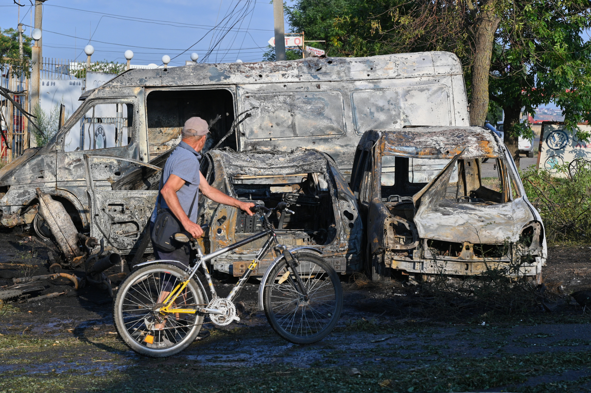 A resident looks at the destruction following a Russian missile attack in Odesa, Ukraine, Friday, July 17, 2026. (AP Photo/Michael Shtekel)