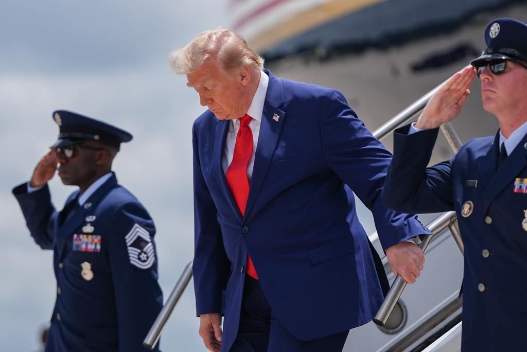Trump descends from Air Force One