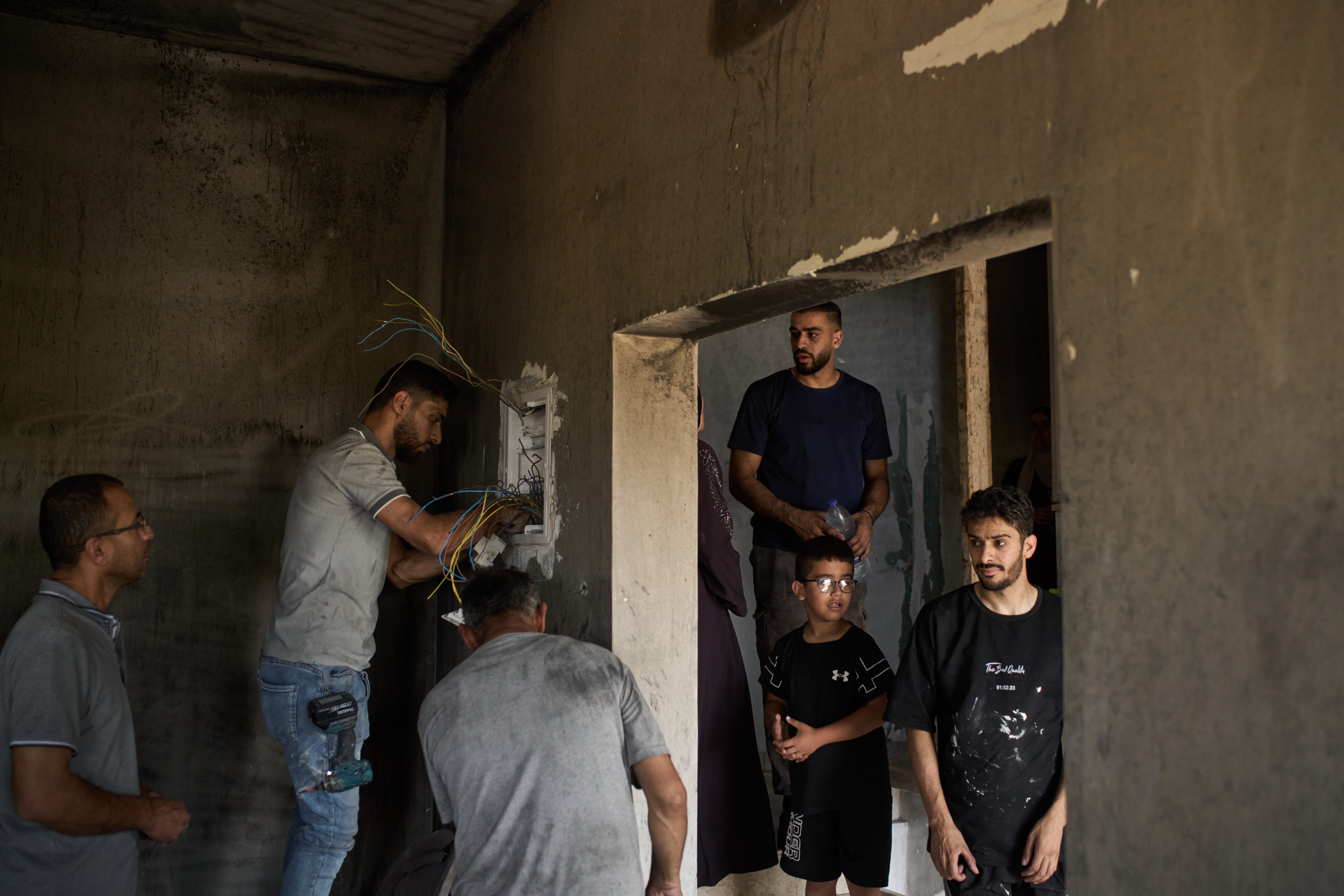 Palestinians repair a damaged house following an attack by Israeli settlers in the village of Sarra, near the West Bank city of Nablus, July 25, 2026