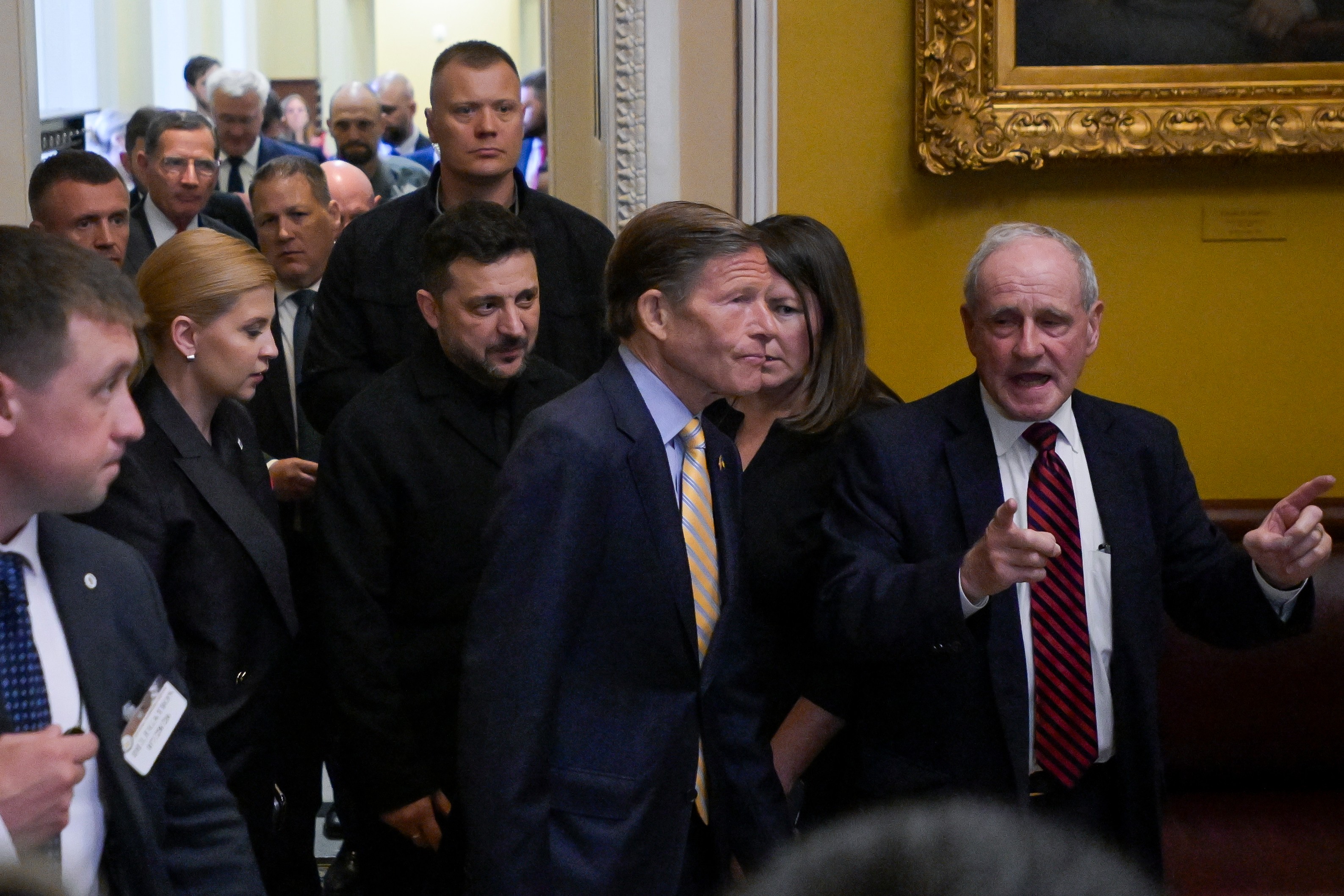 Ukraine's President Volodymyr Zelenskyy, left, leaves the U.S. Capitol with Sen. Richard Blumenthal, D-Conn., center, and Sen. James Risch, R-Idaho, right, following a meeting of bipartisan leaders of the Lindsey O. Graham Sanctioning Russia and Iran Act of 2026, Tuesday, July 28, 2026, in Washington. (AP Photo/Rod Lamkey, Jr.)