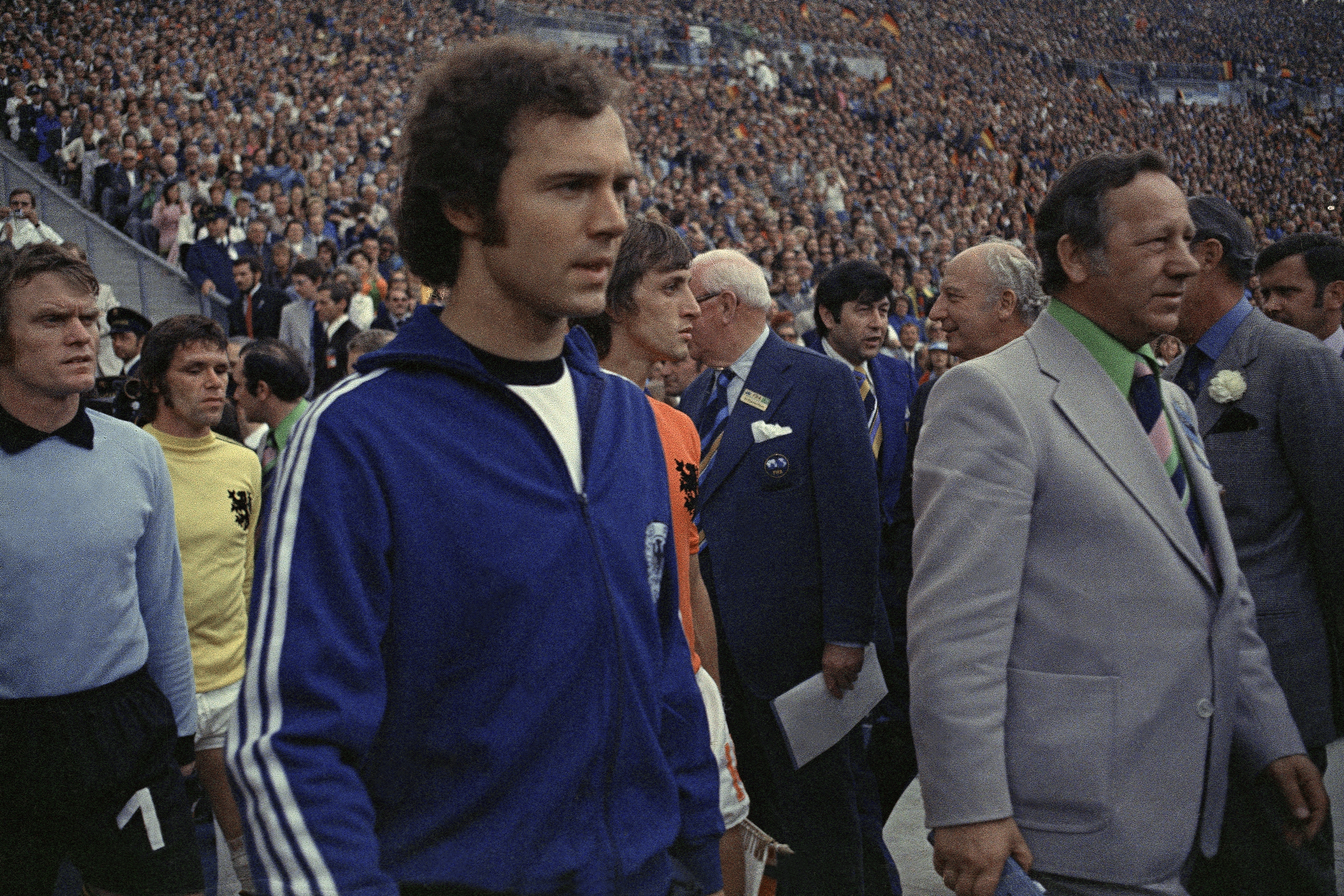West German President Walter Scheel, third from right, and Prince Bernhard of the Netherlands, right partially covered by an unidentified official, welcome the members of the Dutch and West German national soccer team prior to their Football World Cup Final
