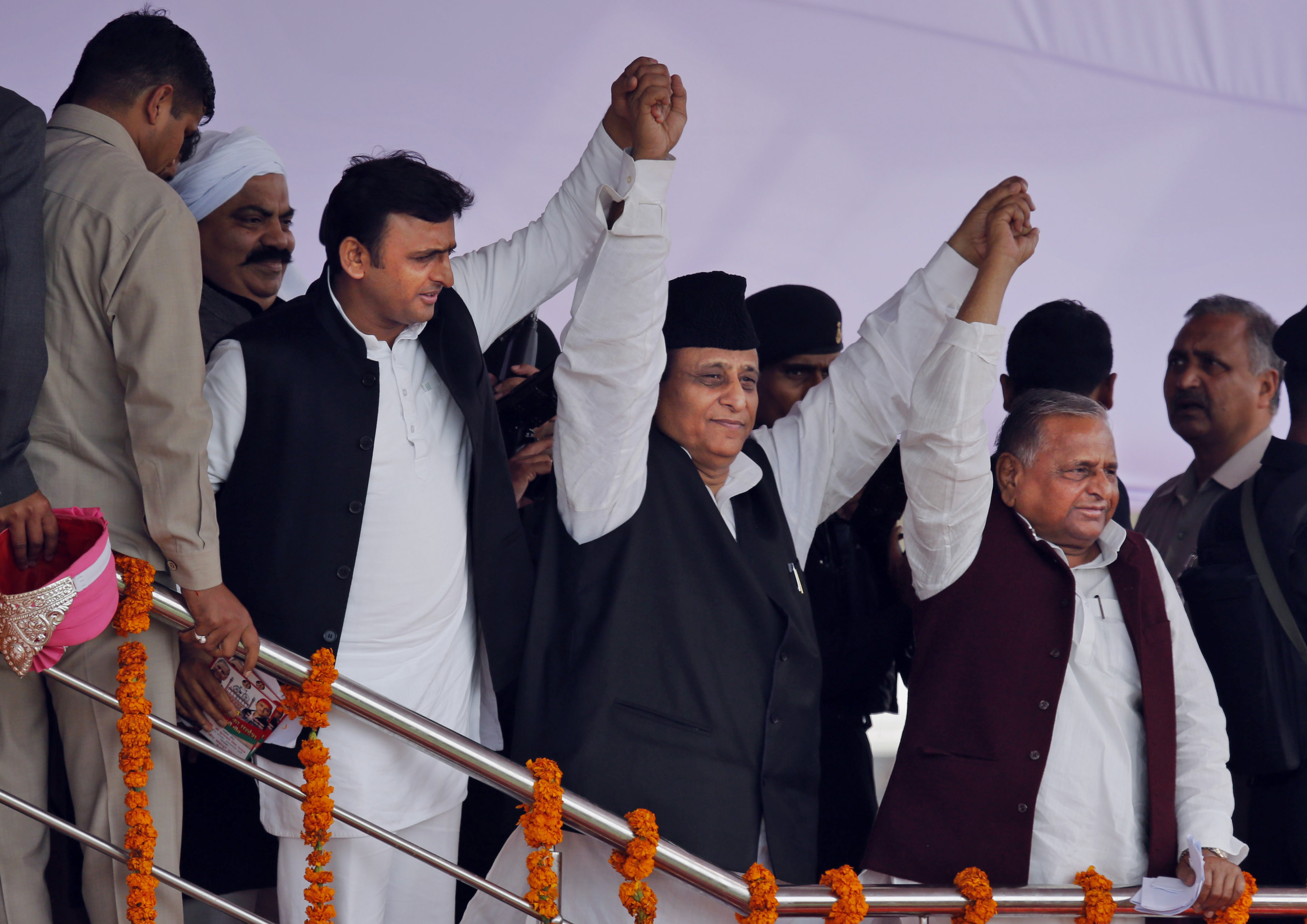 Azam Khan, centre, with Akhilesh Yadav, left, and Mulayam Singh Yadav at a public rally in Prayagraj, India, March 2, 2014
