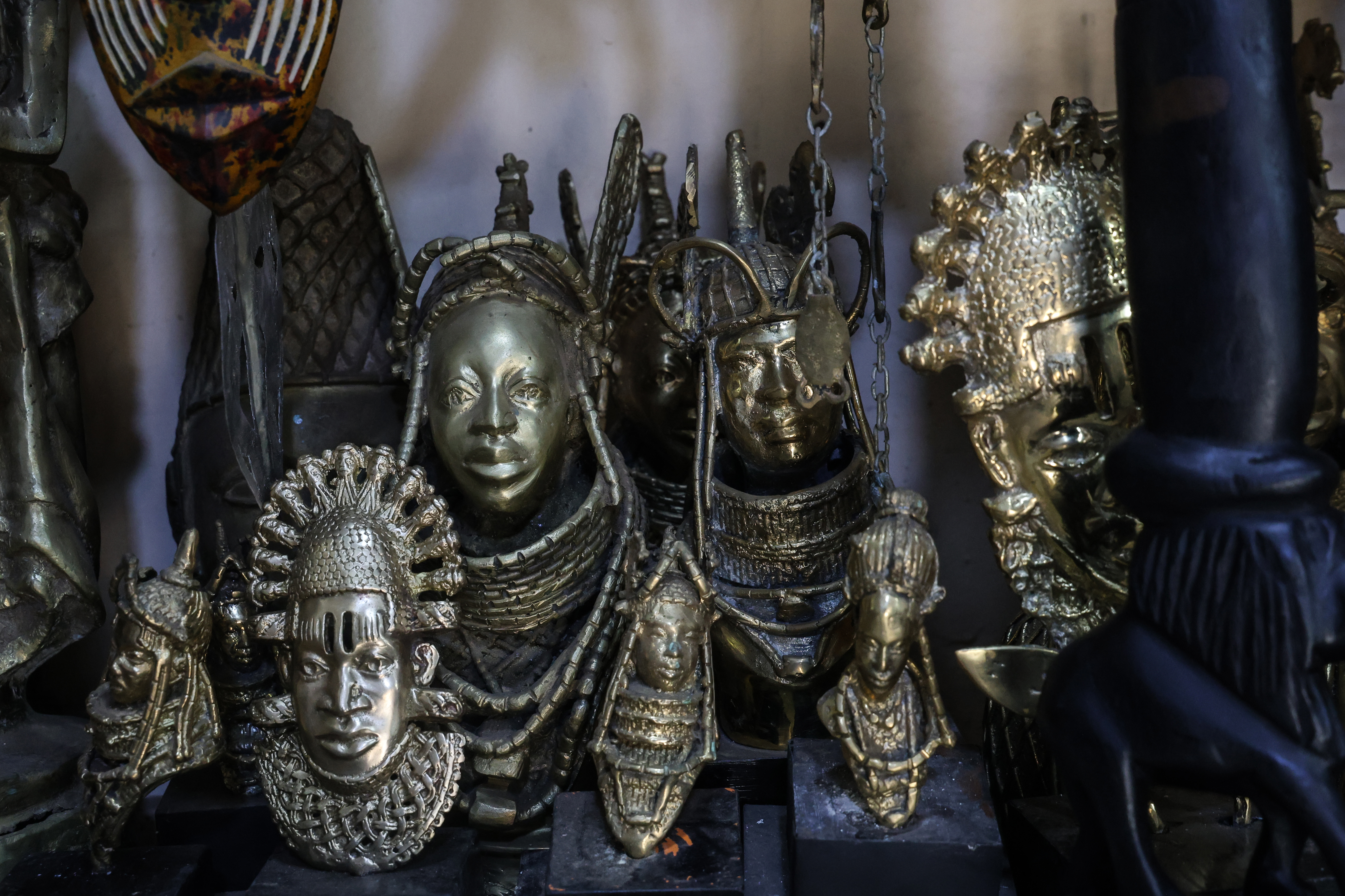 Sculptures of kings, queens, warriors and deities fill an artisan's gallery on Igun Street