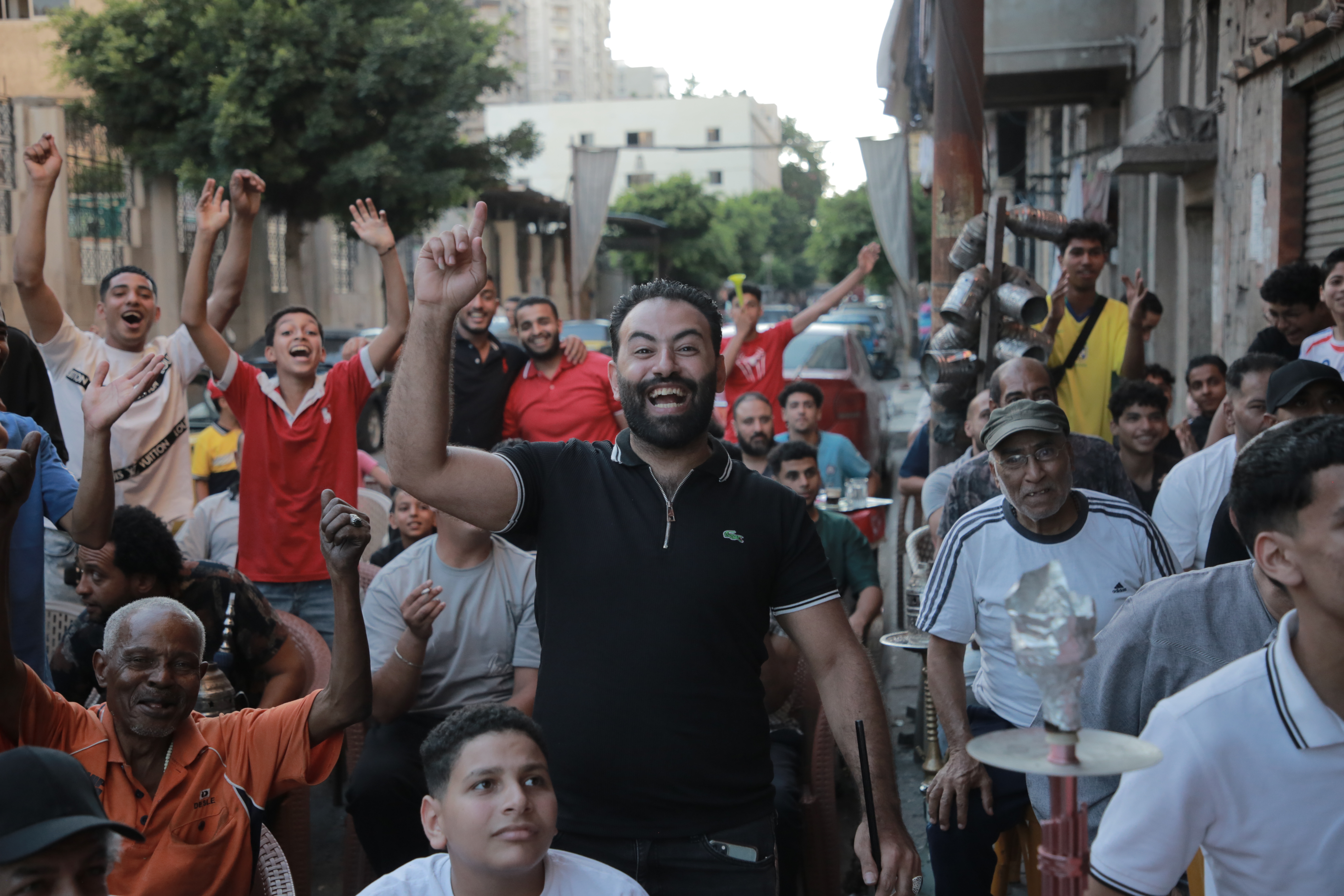 Egypt football fans cheer as they watch their team’s World Cup round-of-16 match against Argentina in Alexandria, Egypt [Al Jazeera]