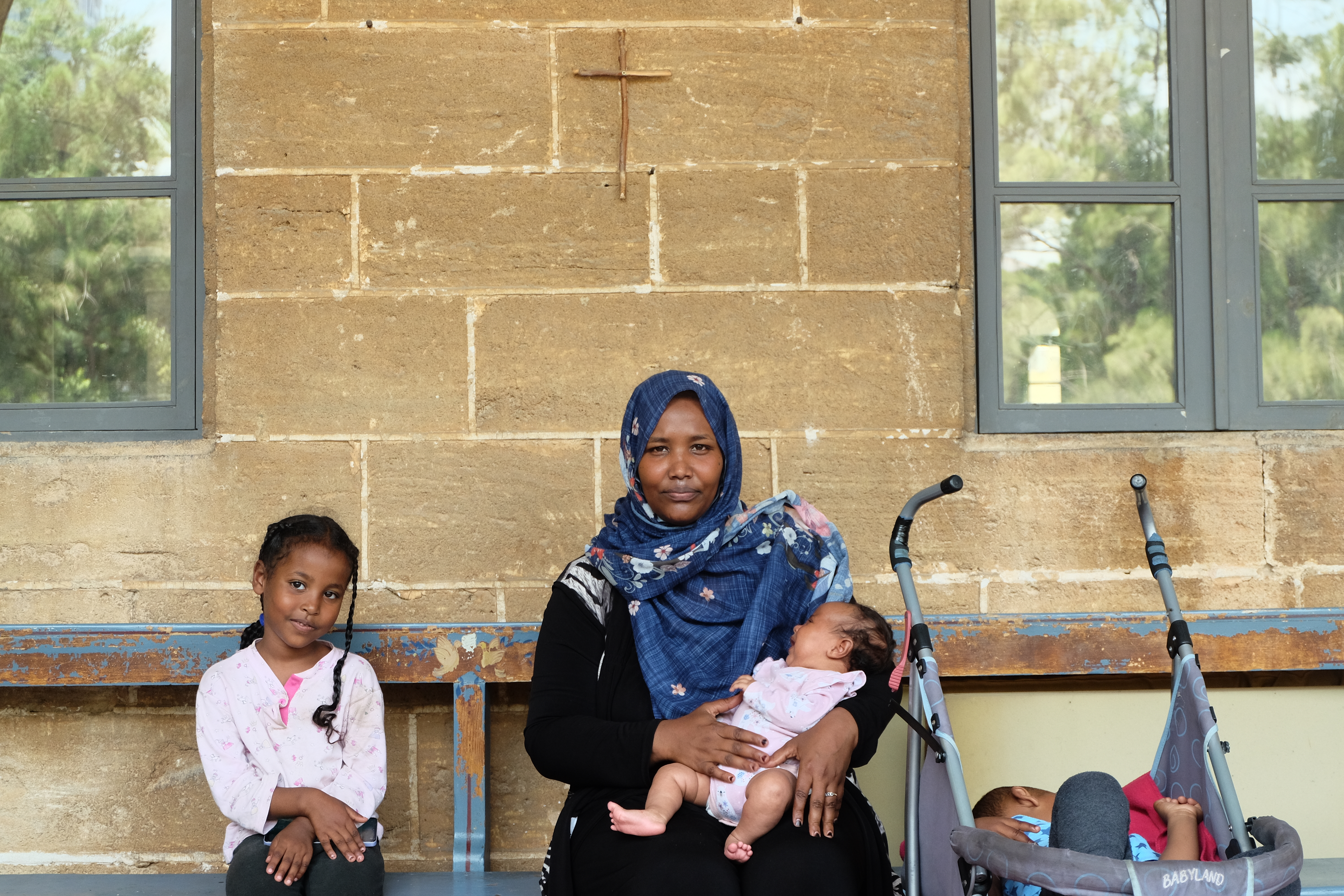 Roudaina Mustafa sits with some of her children at St Joseph Church in Beirut, where the family found shelter after renewed fighting forced them from their home