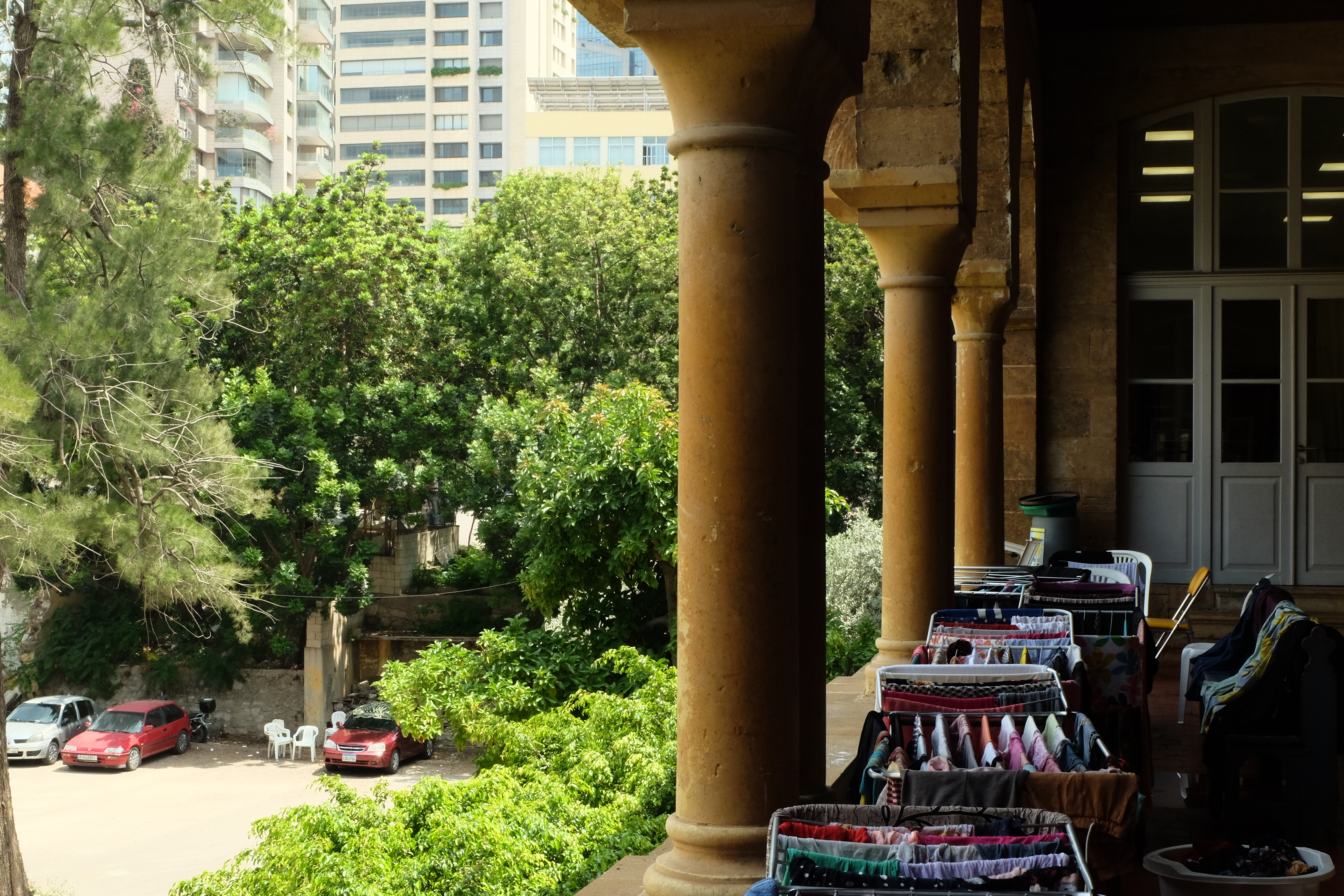 Washing dries beneath the church's arches at St Joseph Church in Beirut, now a refuge for displaced migrant families