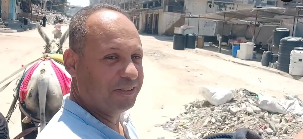 Dr Hassan Almukayed rides in a cart pulled by a donkey to Kamal Adwan Hospital after his car was destroyed in an Israeli strike in Gaza [Courtesy of Nemer Shaheen]
