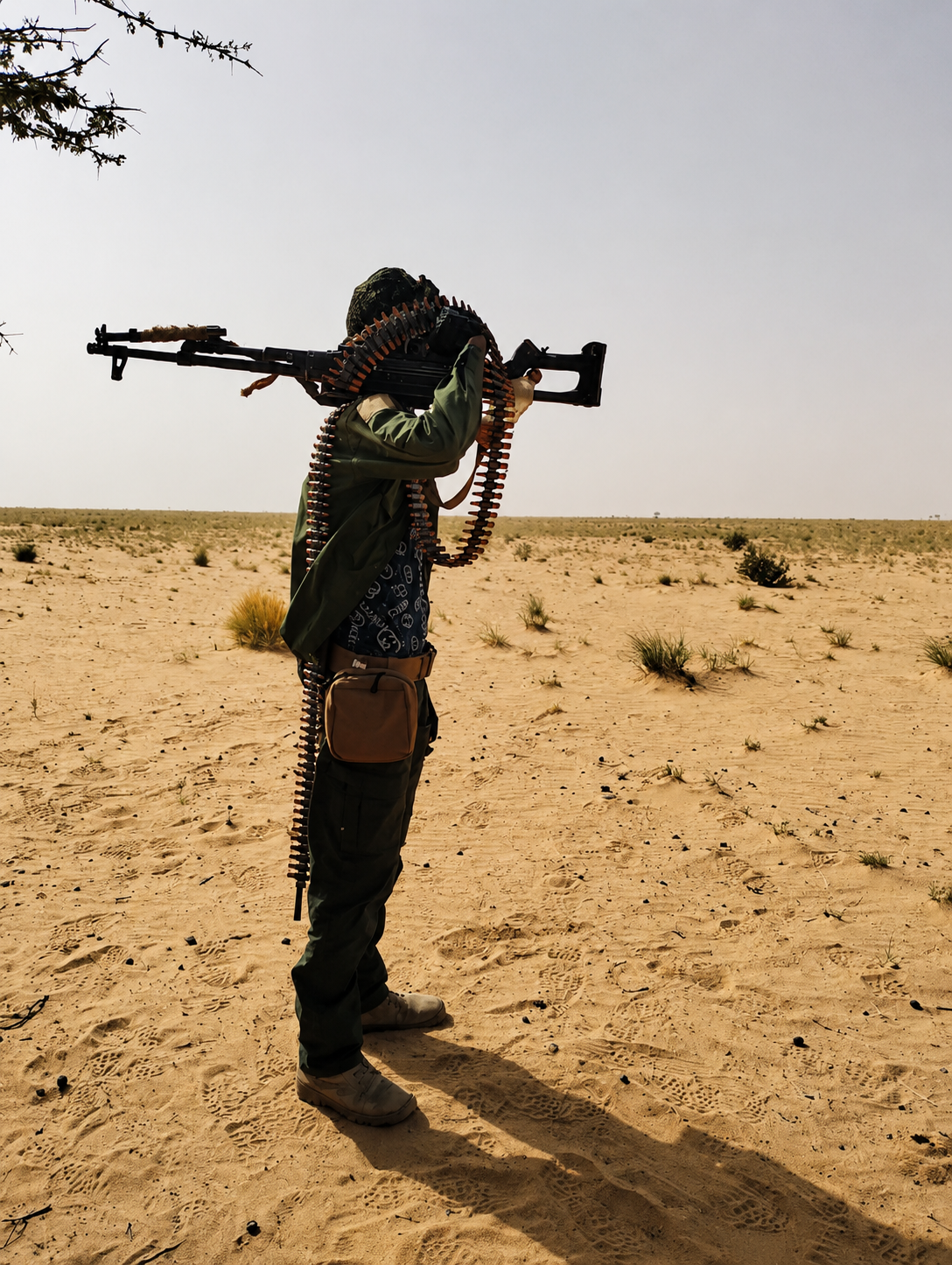 An armed man carries a weapon in a desert area of northern Mali, where government forces and armed groups have been fighting for control of territory [Photo: Courtesy of the Azawad Liberation Front (FLA)]