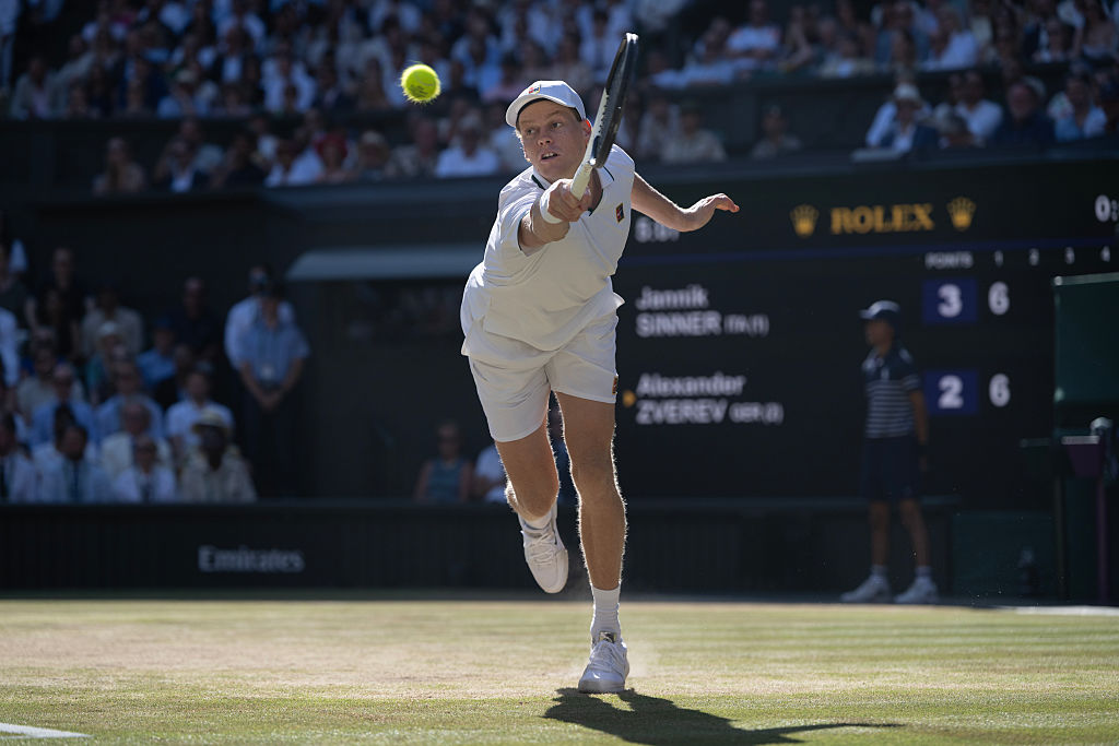 Jannik Sinner of Italy plays a backhand against Alexander Zverev of Germany during their Gentlemen's Singles final match on day fourteen of The Championships Wimbledon 2026 at All England Lawn Tennis and Croquet Club