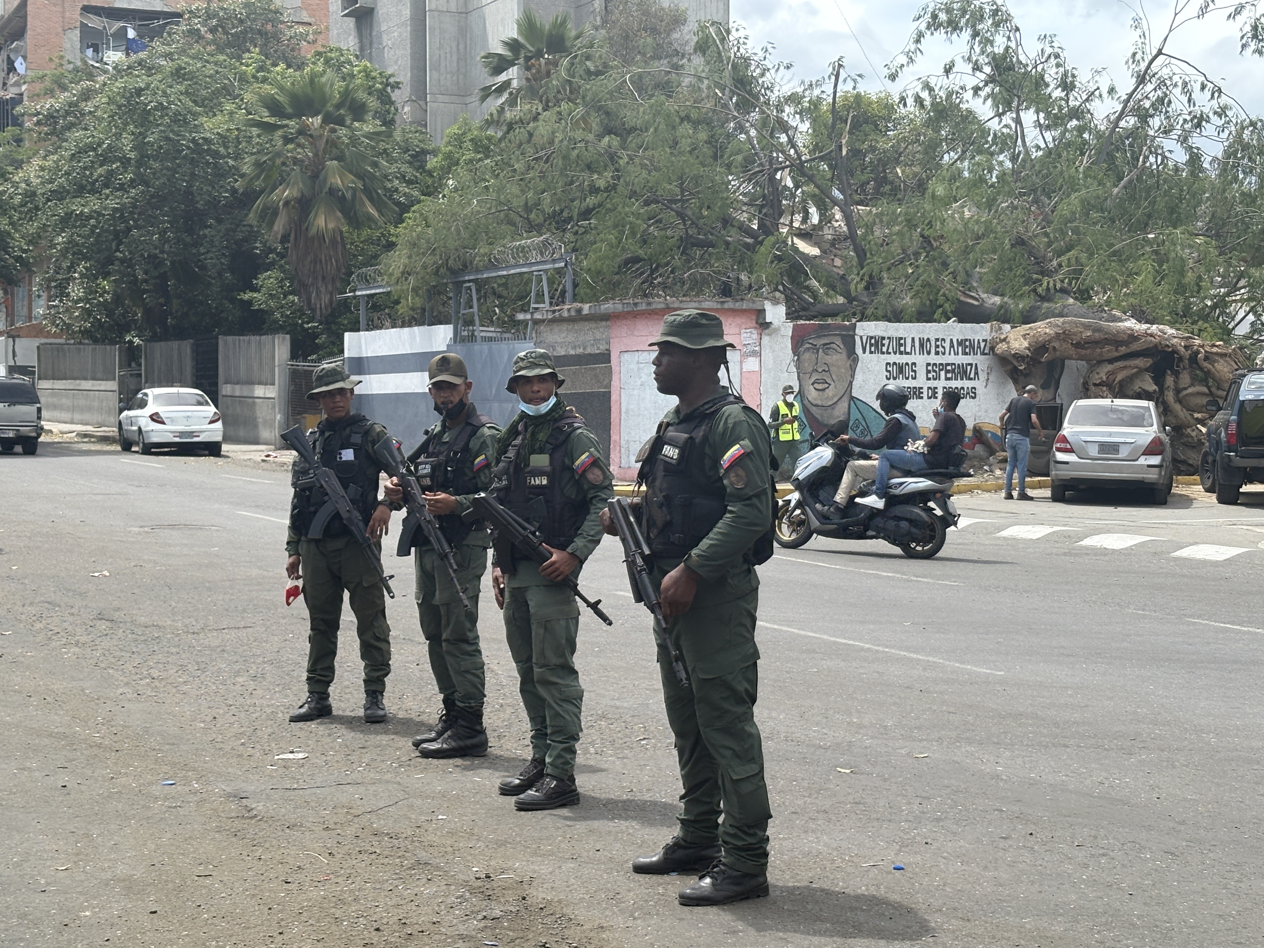 Soldiers stand near the main road to Catia la Mar, a beachside city in Venezuela