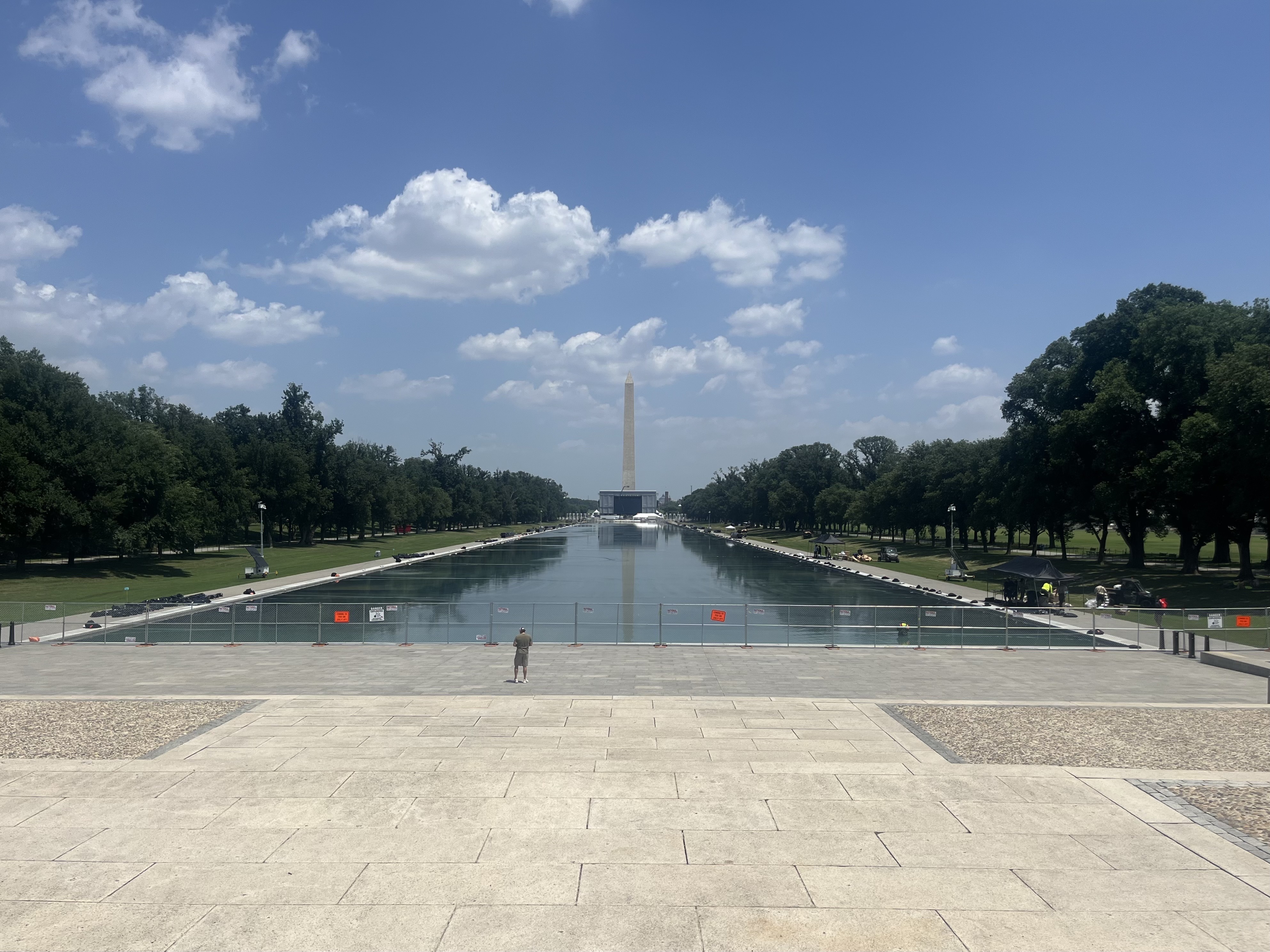 The Reflecting Pool has been fenced off amid ongoing work to kill the algae bloom and fix the peeling paint