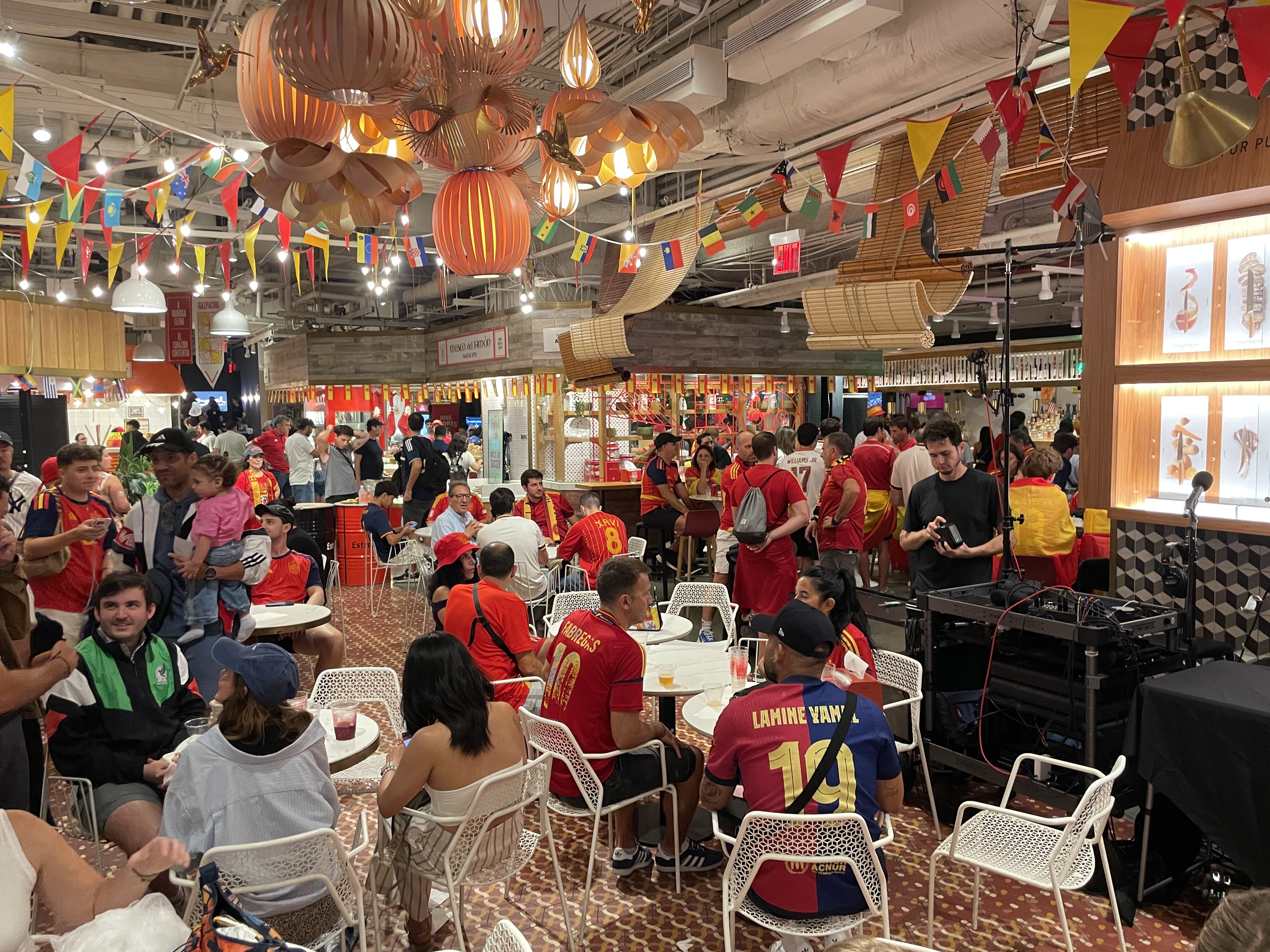 Spanish fans are seen at Mercado Little Spain in Manhattan