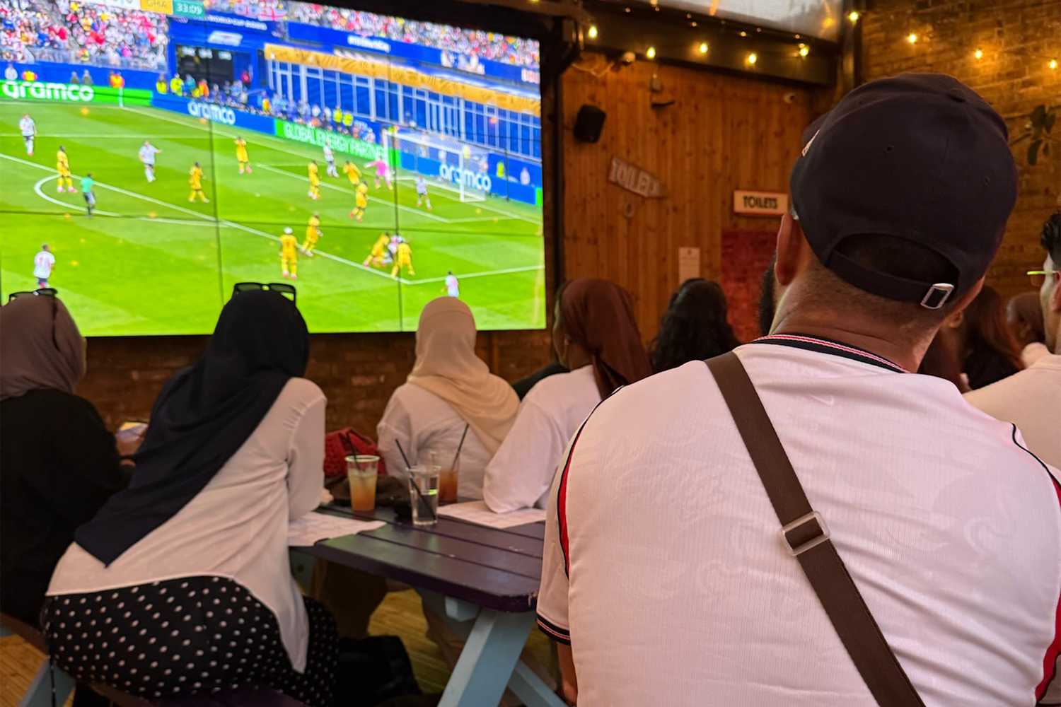 Fans watch a match at an event organised by The Scene, a collective which offers alcohol-free settings [Courtesy of Shabna Zaheer]