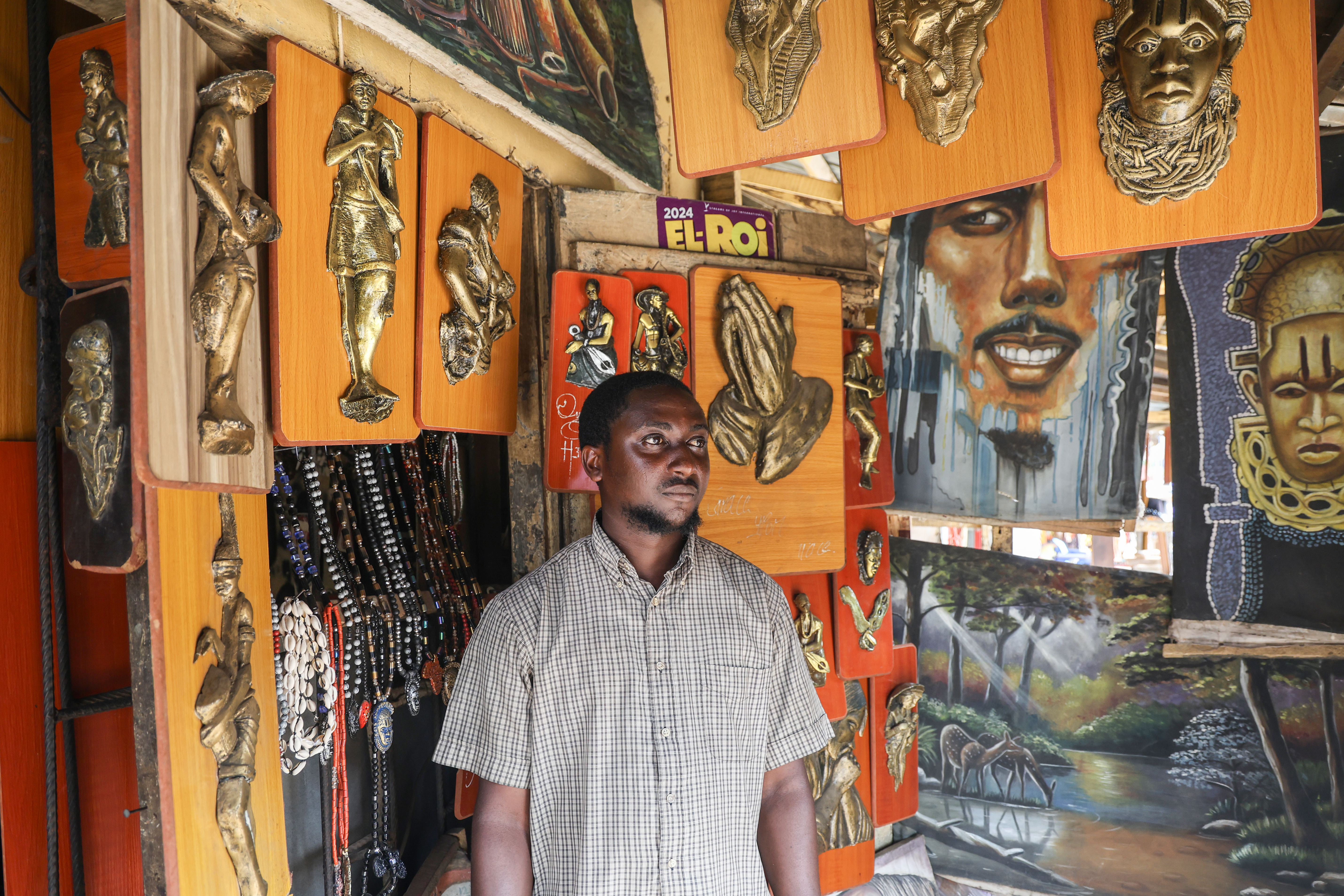 Bronze caster Otasowie at his workshop in Benin City