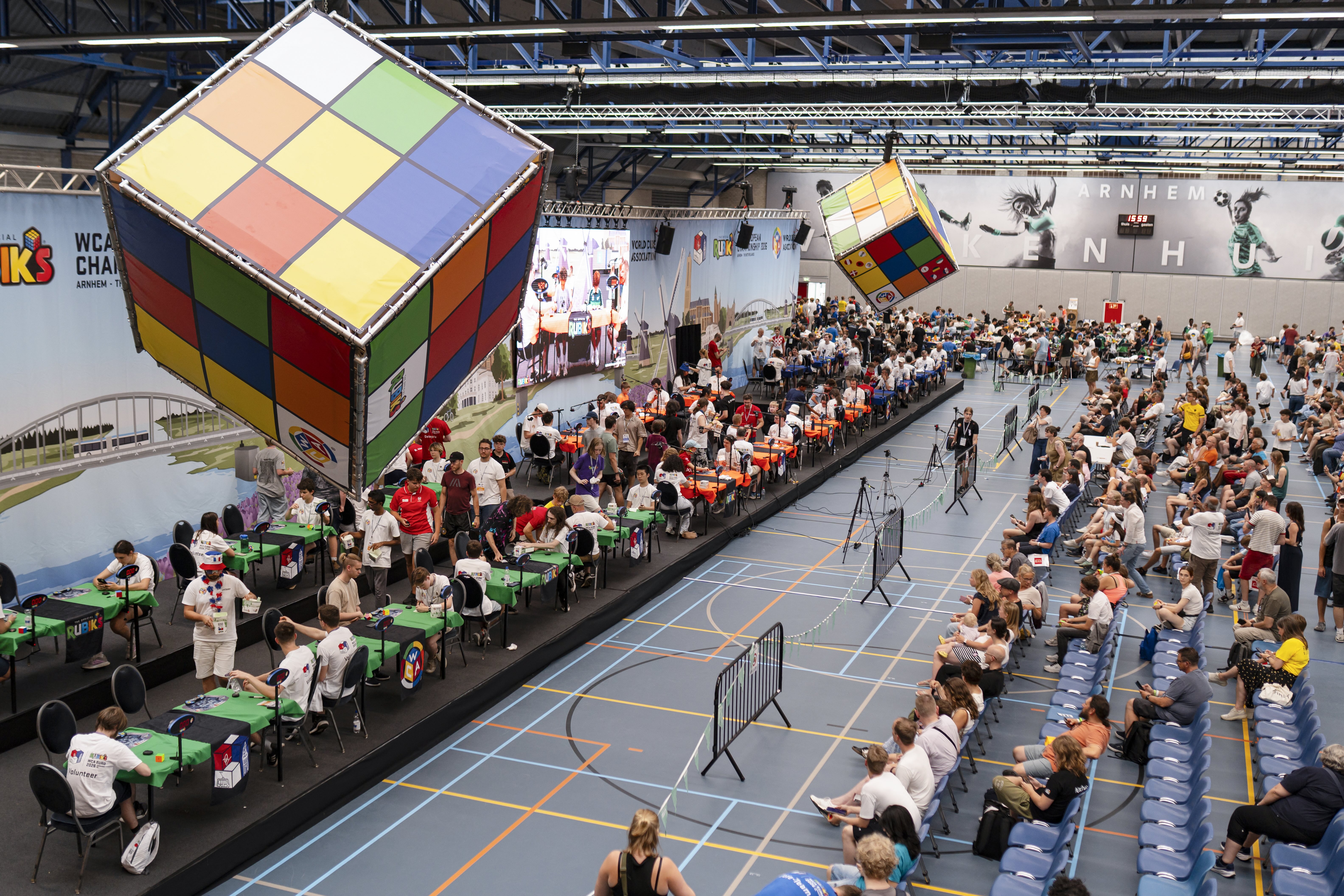 This photograph shows a general view of the Rubik's WCA (World Cube Association) European Championship 2026 in Arnhem on July 17, 2026. The championships are Europe's premier speedcubing competition bringing together approximately 1,200 competitors from across the continent to battle for titles in 17 official World Cube Association events, including the traditional 3x3x3 Rubik's Cube, blindfolded solving and one-handed disciplines. The championship runs from July 16-19. (Photo by Lina Selg / AFP)