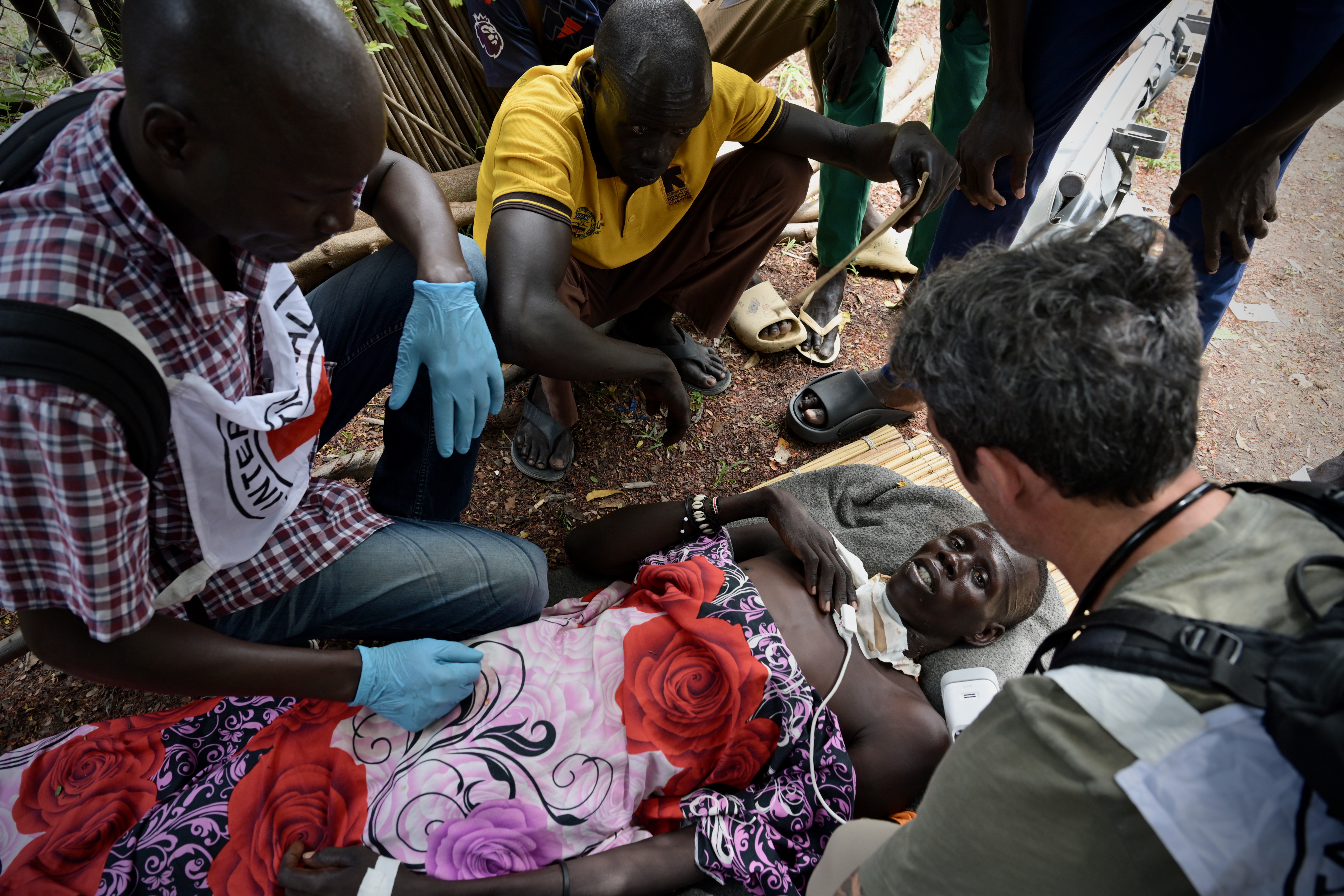ICRC Nurses attend to a victim of gunshot wounds at Ganyiel Primary Health Center before being evacuated to Juba for further medical care. [Handout/ICRC]