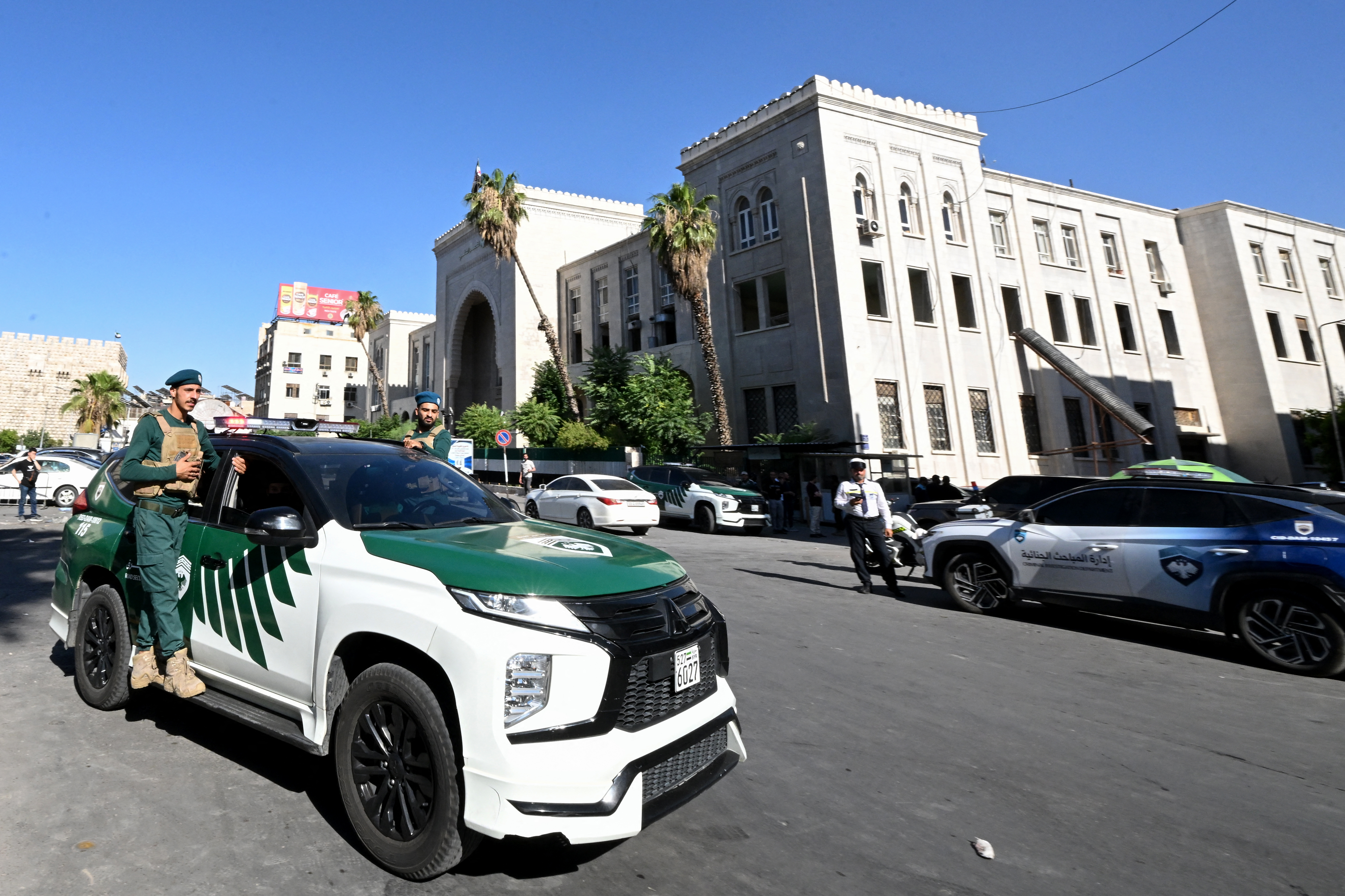 Syrian security forces secure the area around the Palace of Justice in the capital Damascus following an explosion at a cafe nearby on July 2, 2026.