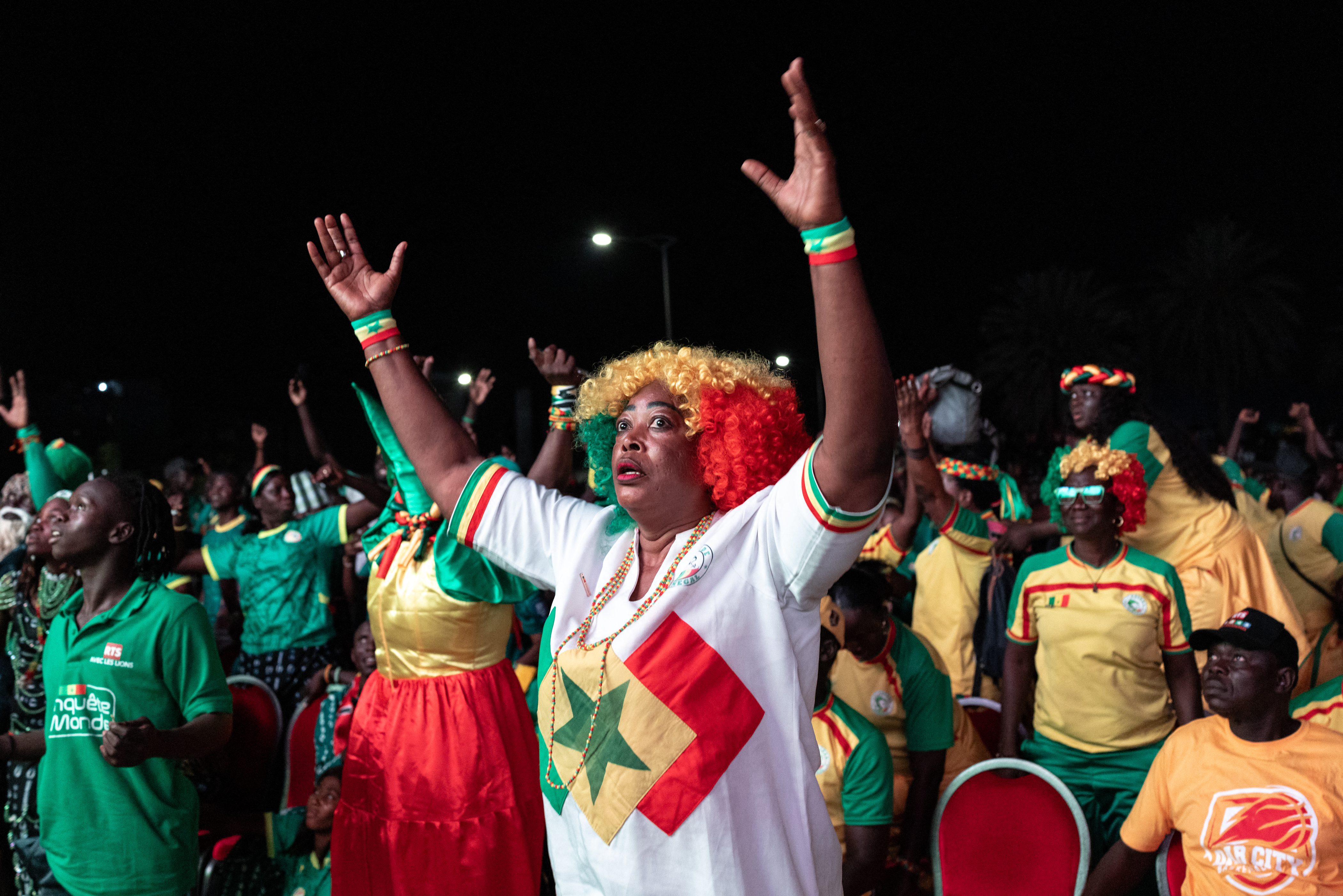 Senegal supporters react as they watch the 2026 World Cup round of 32 football match between Belgium and Senegal at the FIFA Fan Zone at the Place de l'Obelisque in Dakar on July 1, 2026.