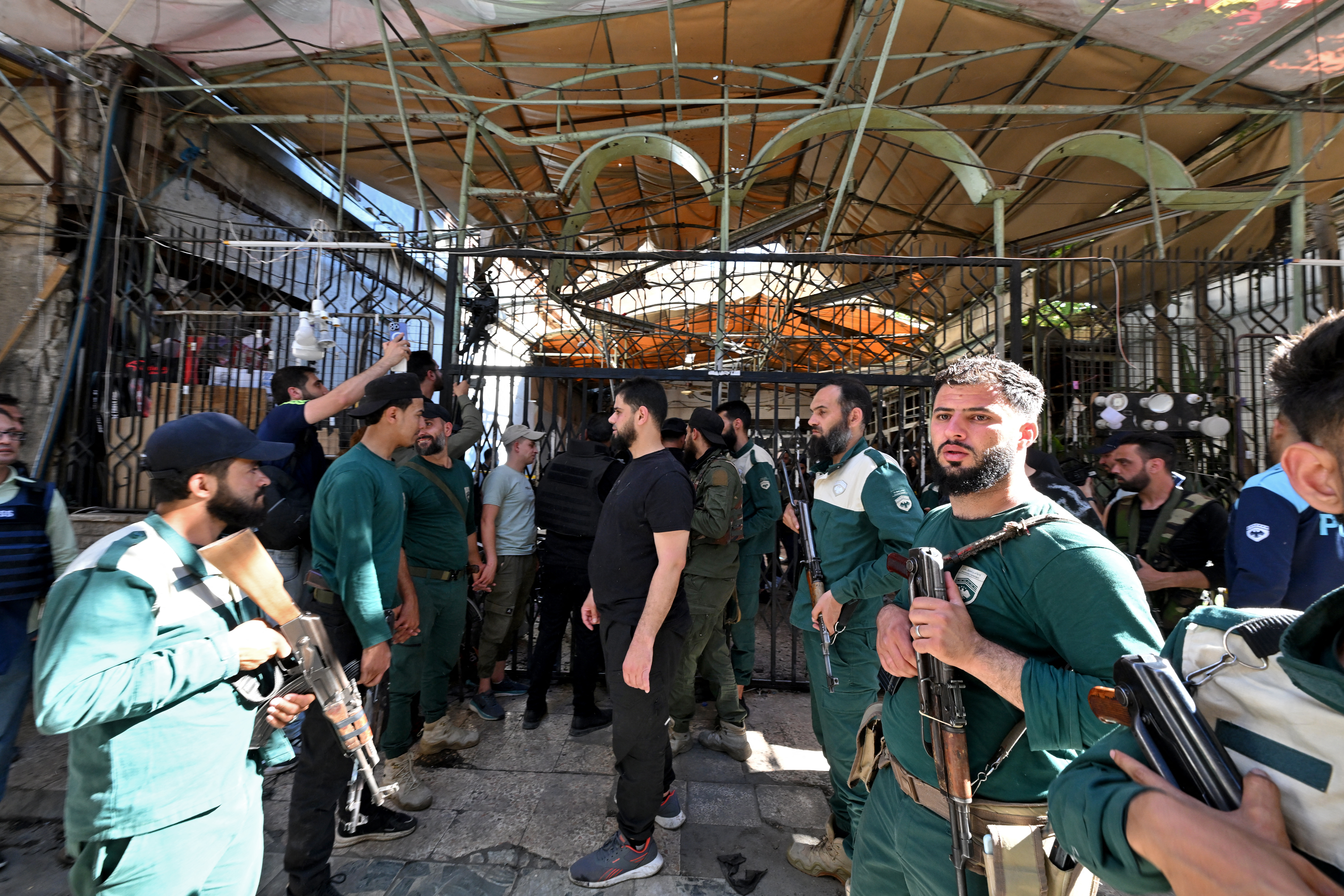 Syrian security forces gather at the site of an explosion at a cafe in the capital Damascus on July 2, 2026.